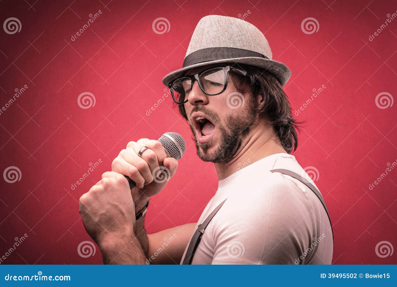 I Sing Of Arms And A Man Man Singing with a Microphone Stock Photo - Image of young, sing: 39495502