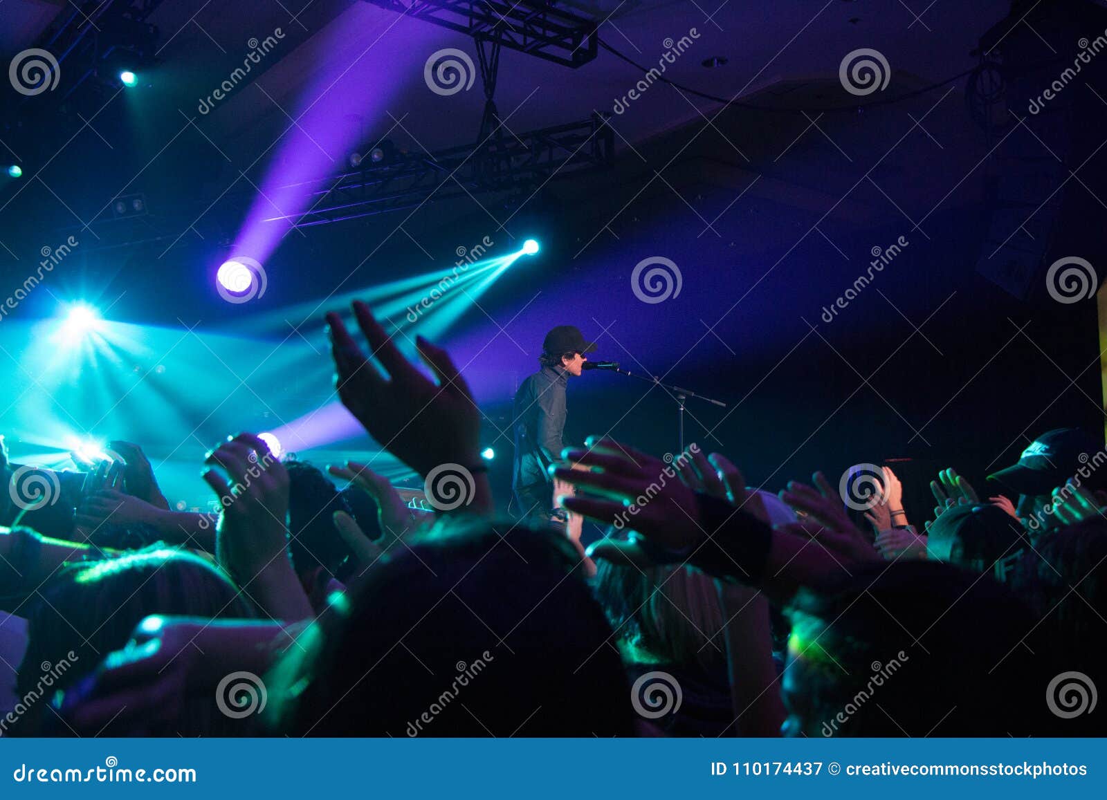 Man Singing On Stage With Stage Lights Near Crowd Picture. Image: 110174437