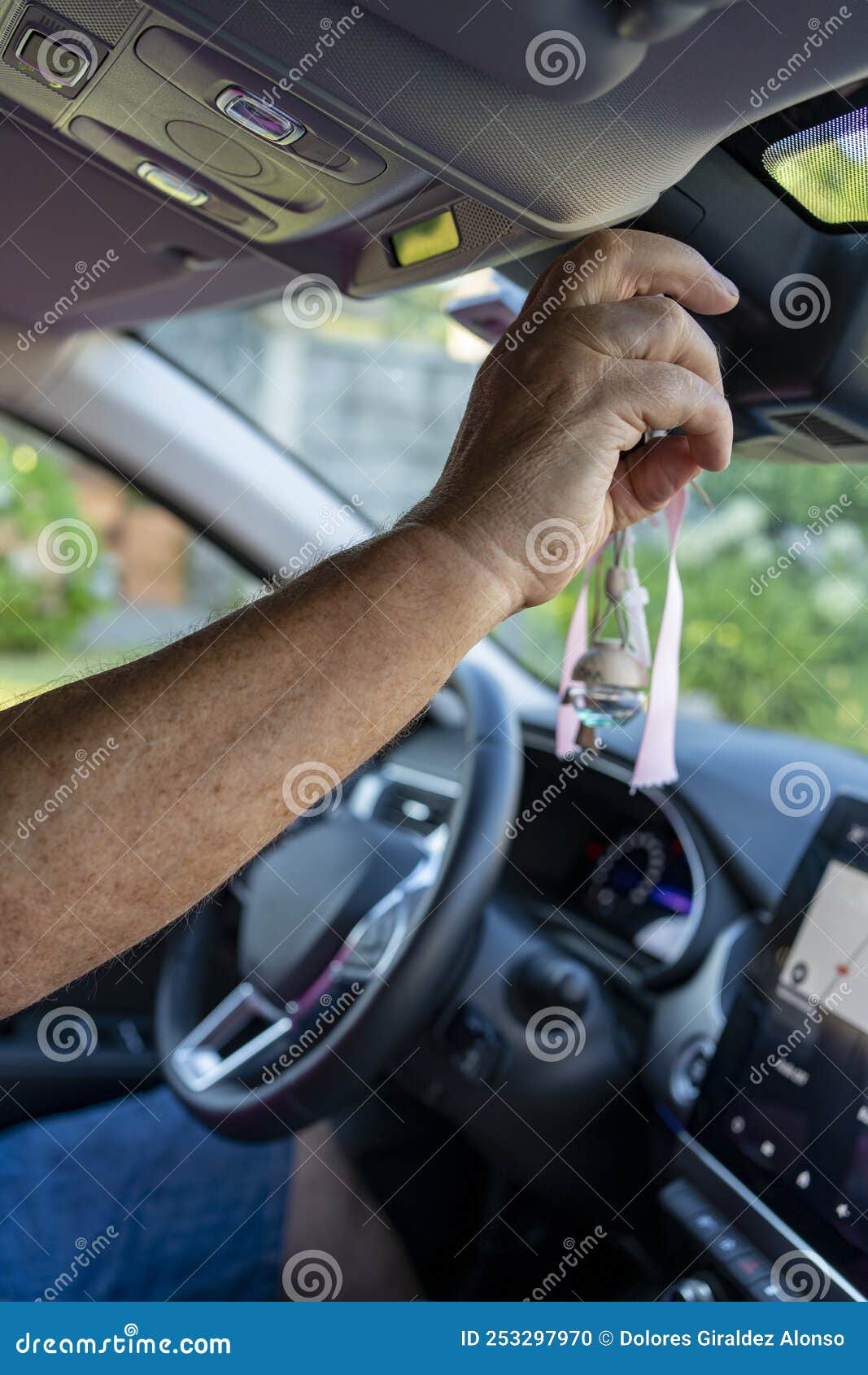 Man Adjusting A Rearview Mirror Stock Photo - Download Image Now