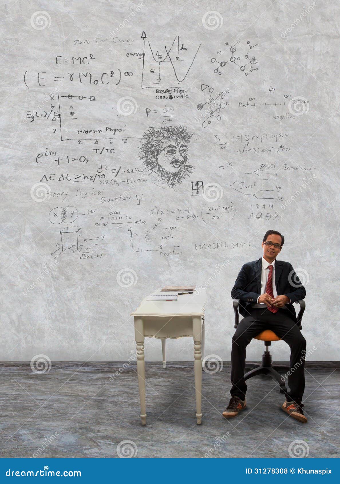 man sitting on desk and physic formula on wall