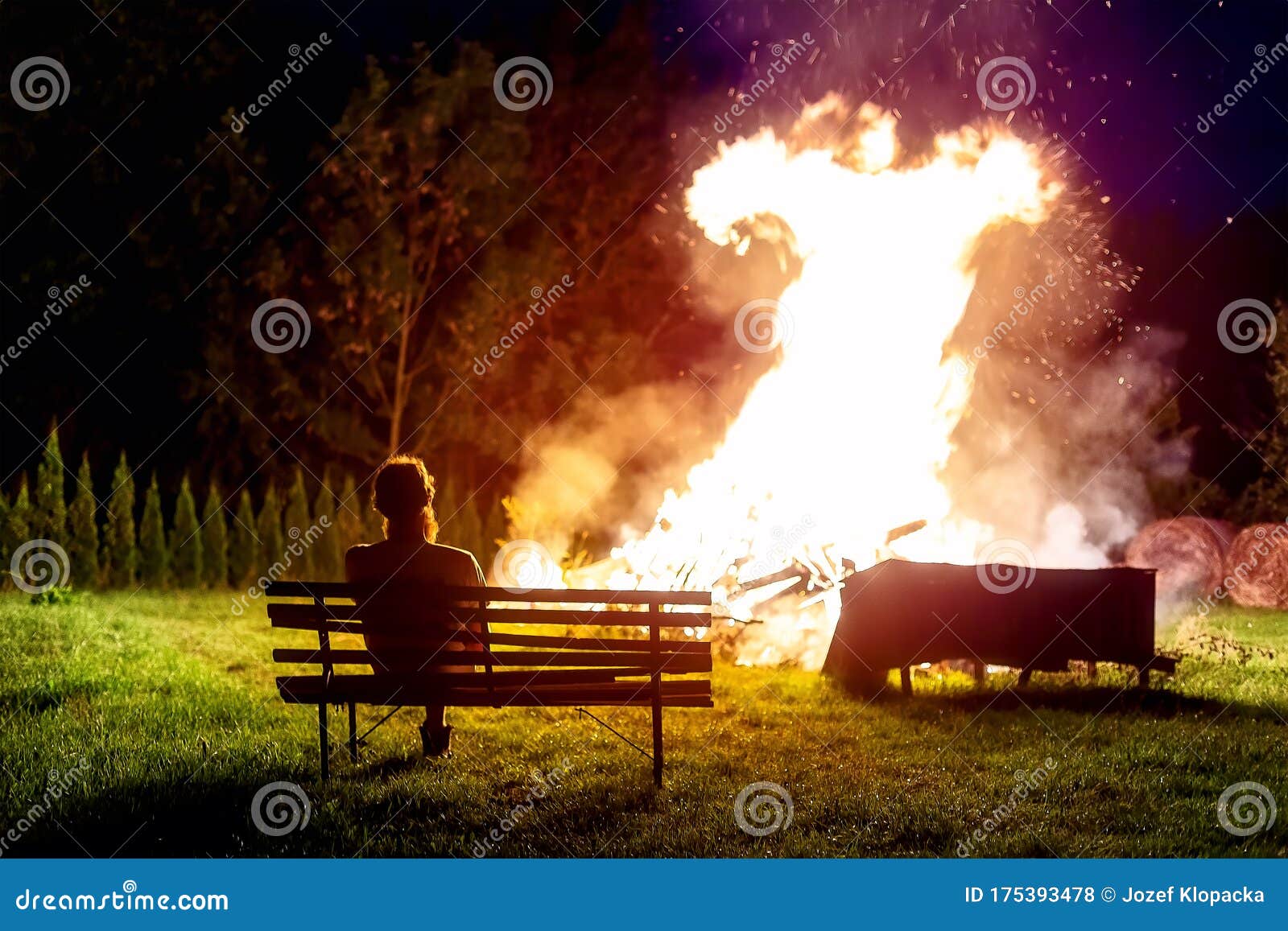 Man Sitting by the Fire and Looking To the Flame. Stock Photo Image of campfire, environment