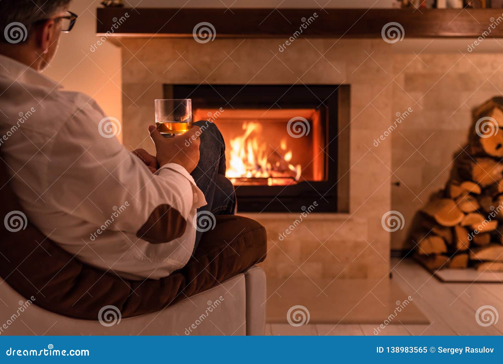 man-sitting-home-fireplace-man-sitting-h