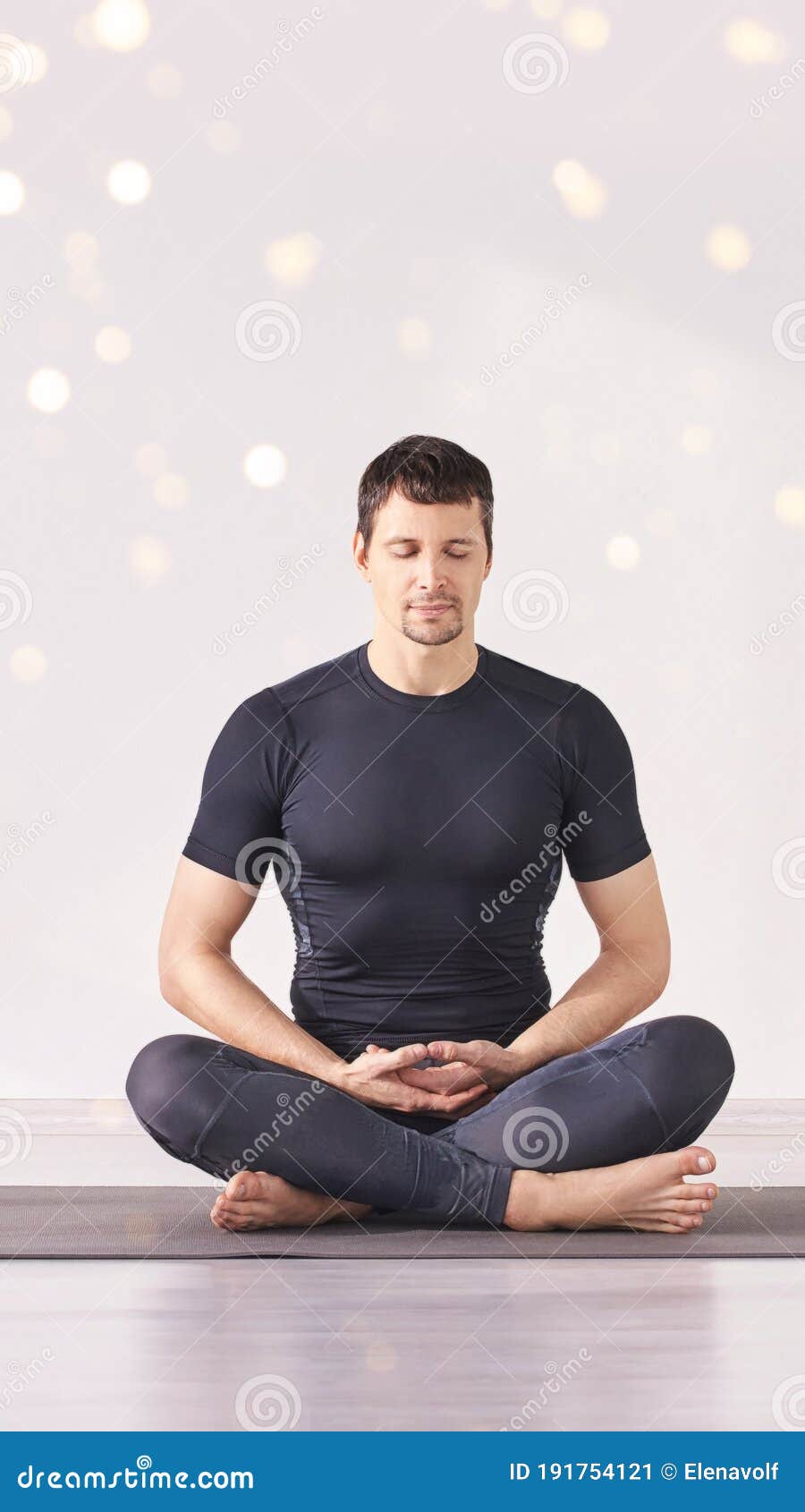 Man Sitting at Lotus Yoga Pose. Home Morning Routine Stock Image