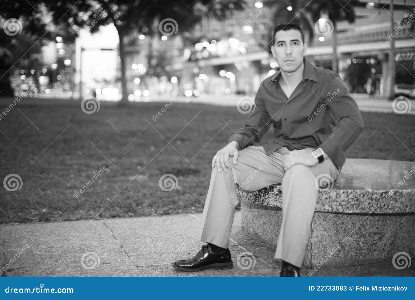 Man Sitting on a Park Bench Stock Image - Image of hispanic, black ...
