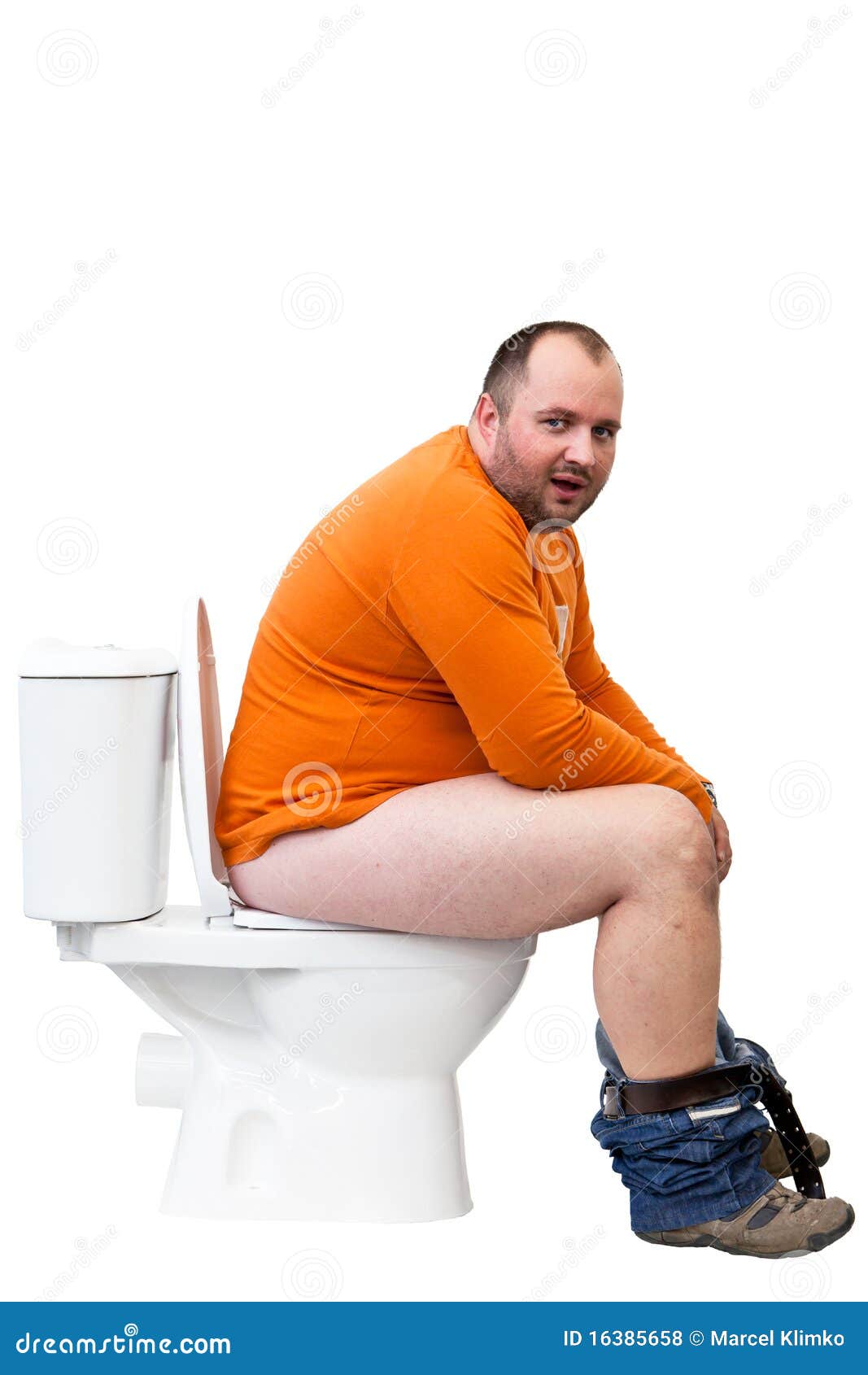 man sitting on toilet