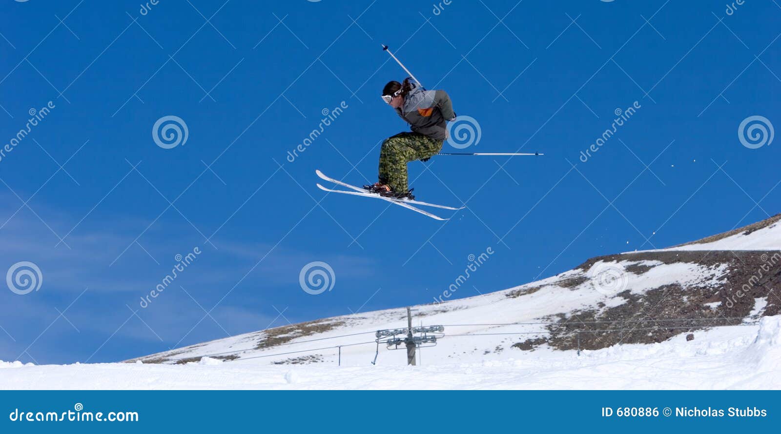 man skiing on slopes of pradollano ski resort in spain