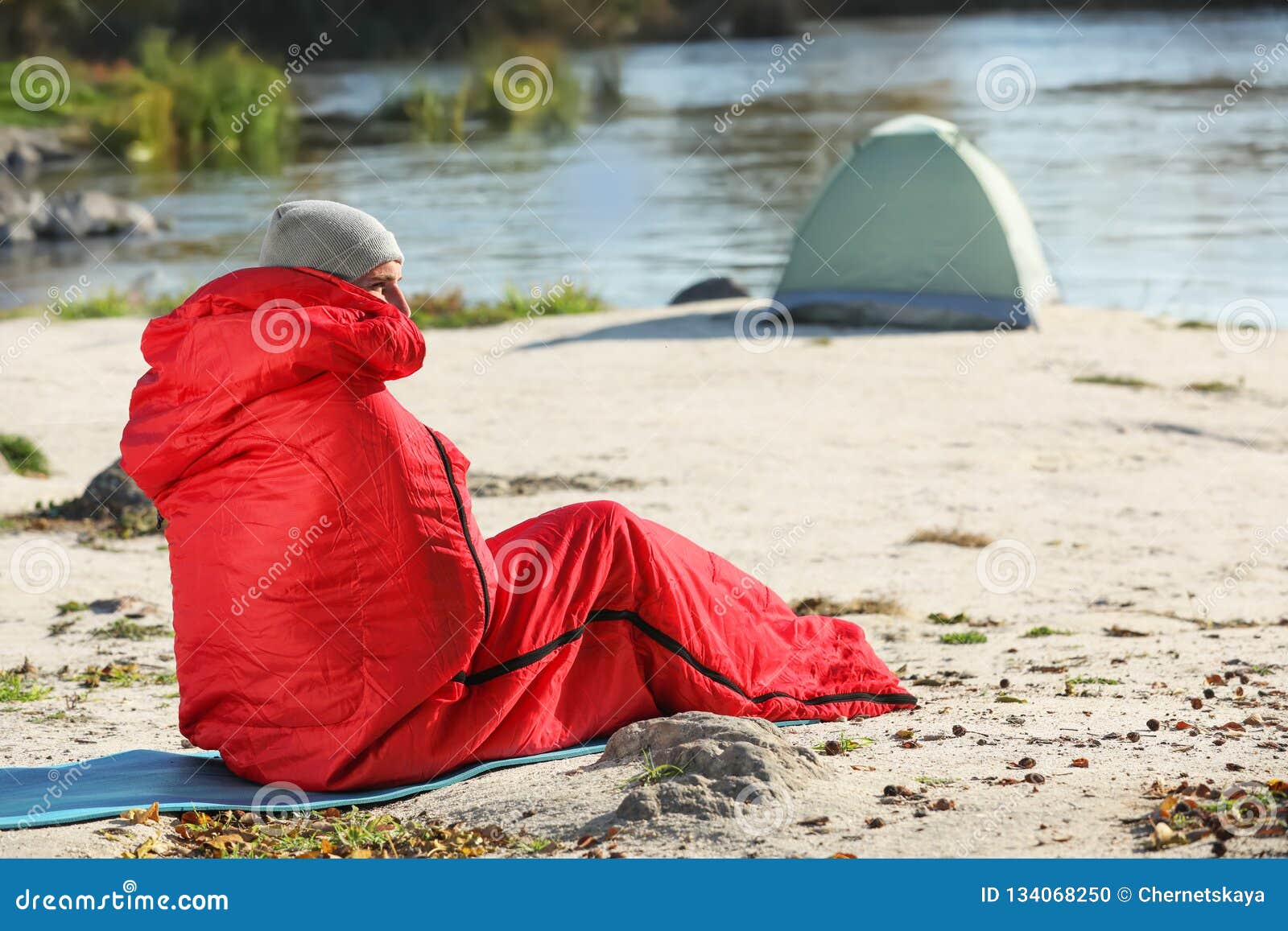 Man in Sleeping Bag on Wild Beach Stock Photo - Image of professional ...