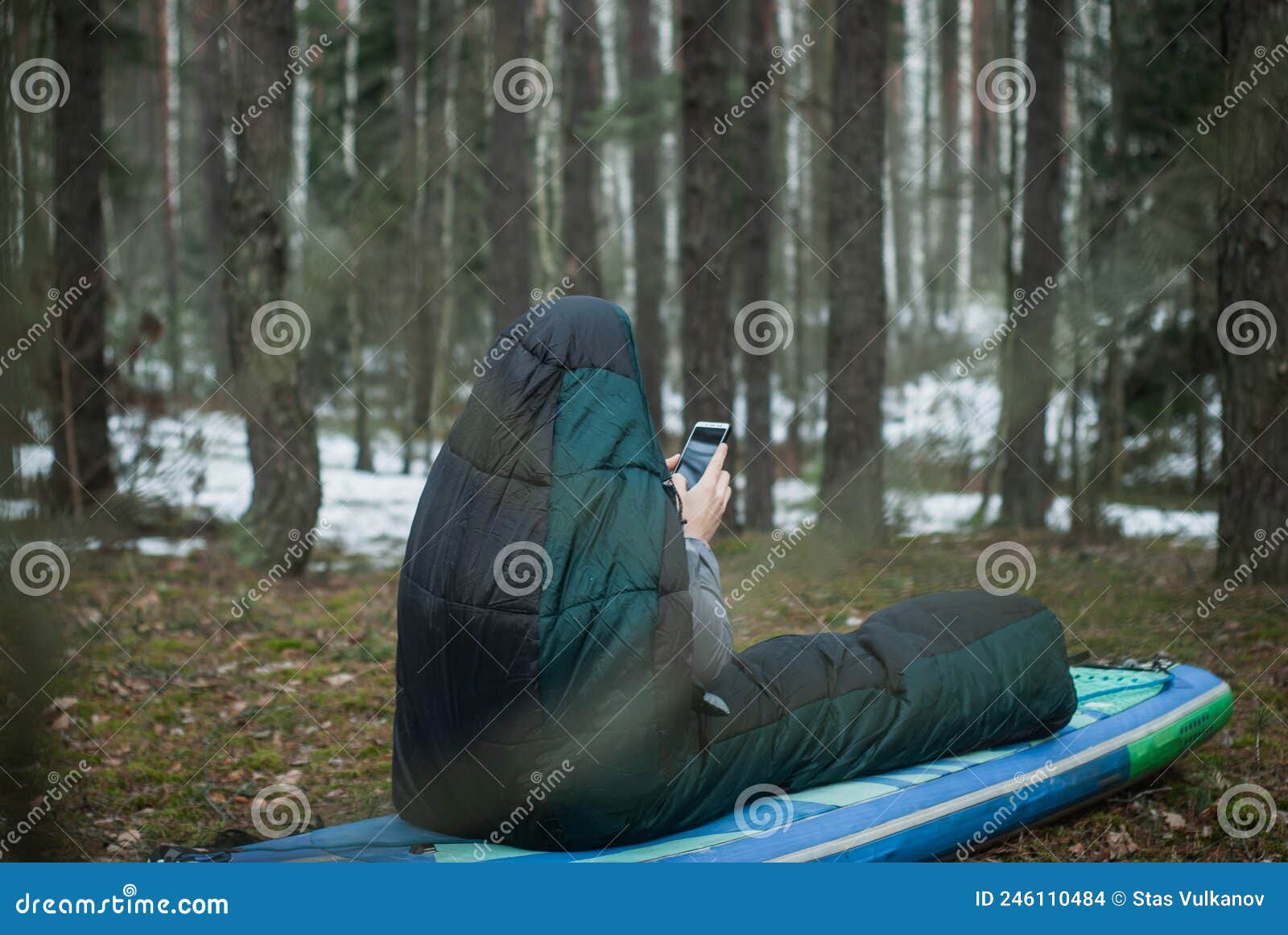 A Man in a Sleeping Bag in the Woods Stock Photo Image of isolated