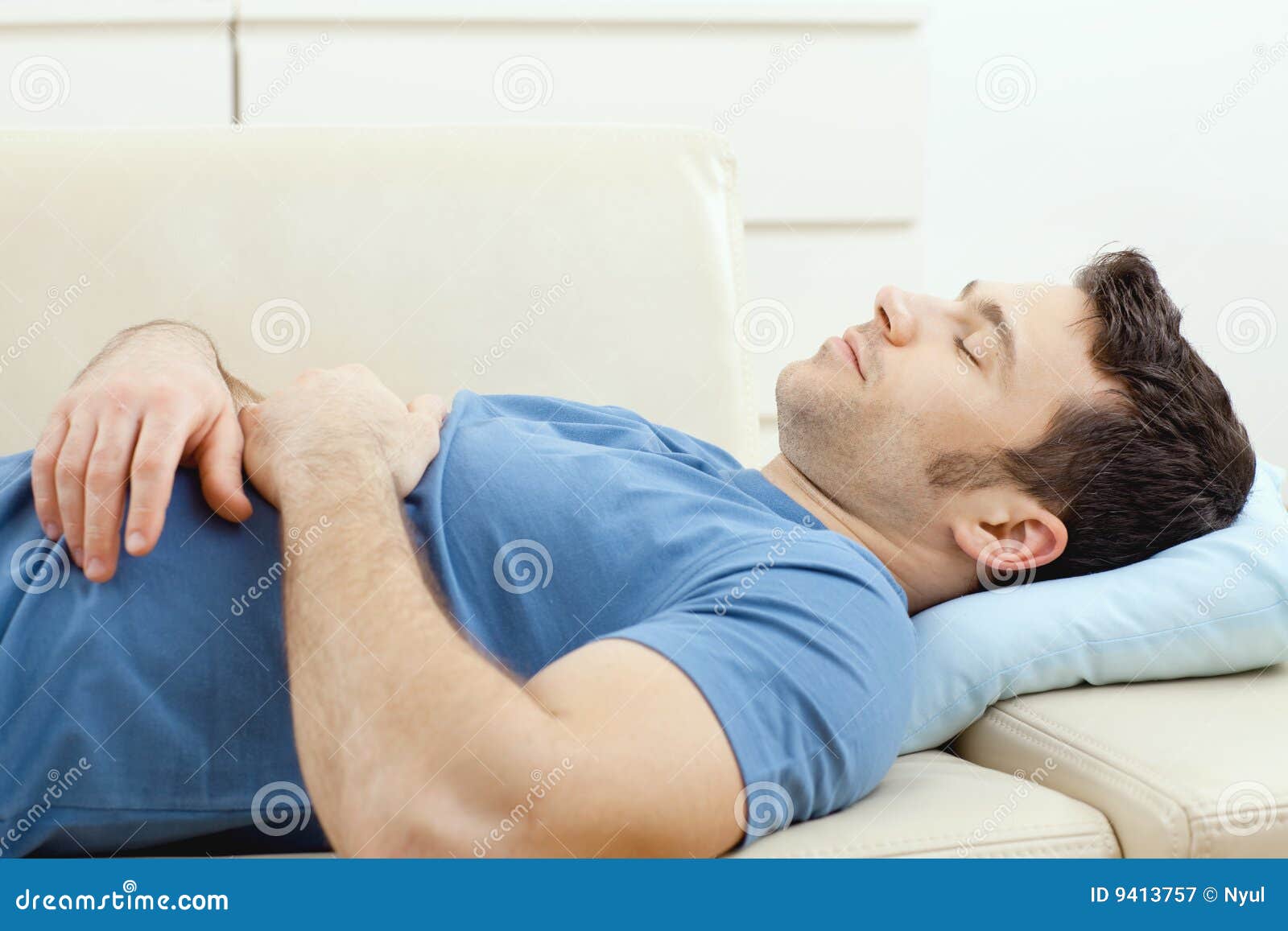 man sleeping on couch