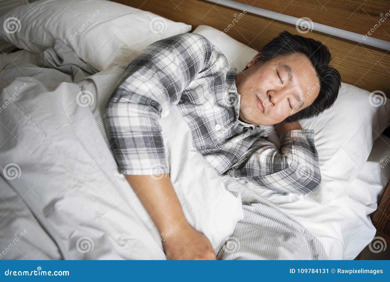 a man sleeping soundly on the bed