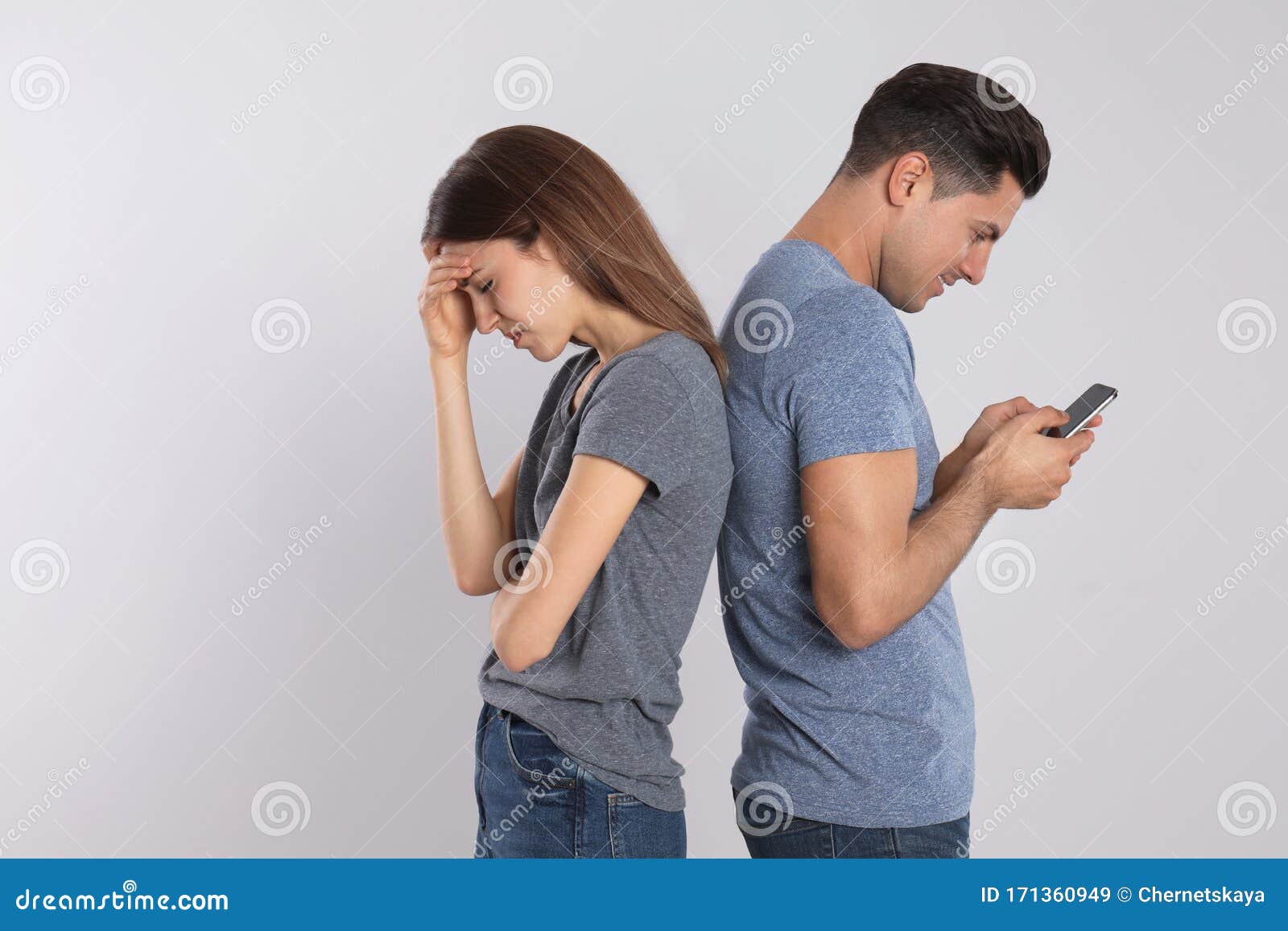 Man with Smartphone Ignoring His Girlfriend on Background. Relationship