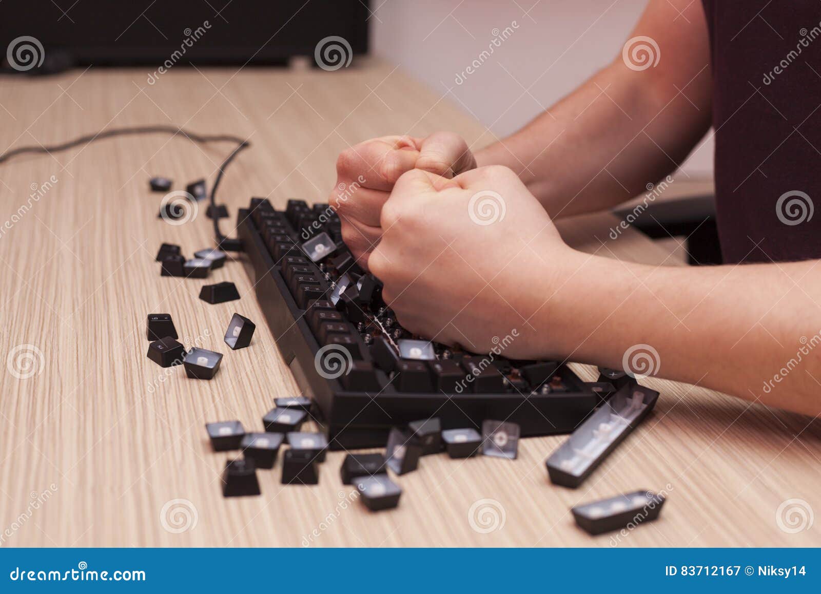 man-smashes-mechanical-computer-keyboard-rage-using-both-fists-stressed-completely-wrecks-anger-83712167.jpg