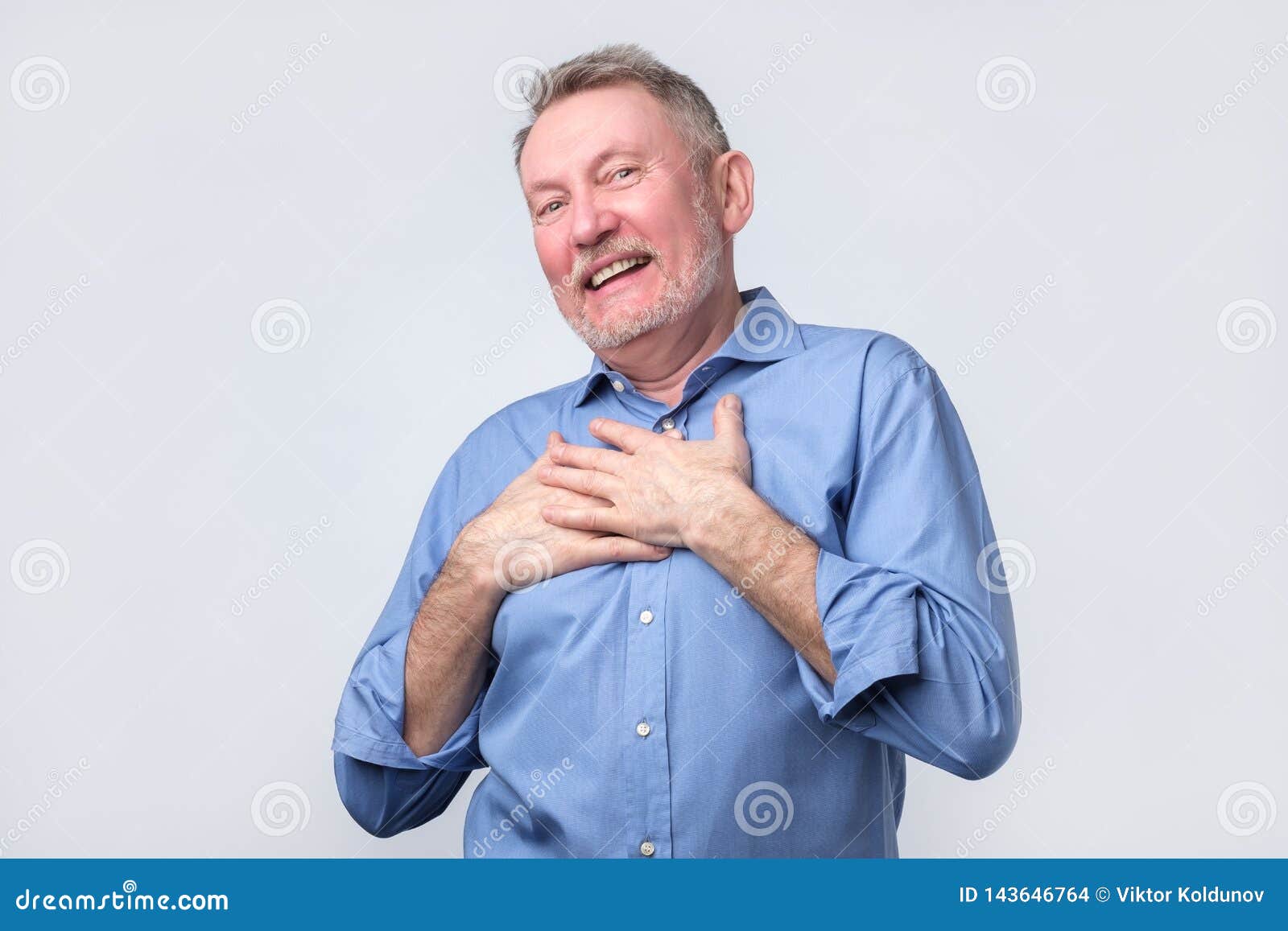 Man Smiles Happily, Keeps Hands on Chest Stock Photo - Image of ...