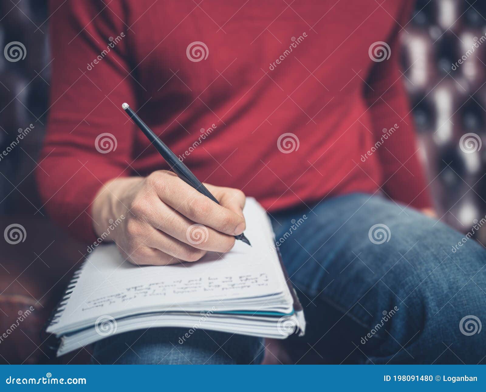 Man on Sofa Writing in Notebook Stock Photo Image of resting, couch