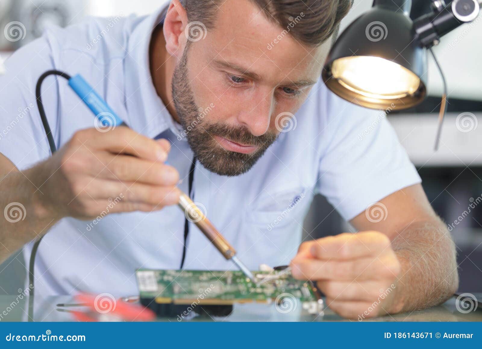 Man with Soldering Iron Repairs Computer Equipment Stock Image Image