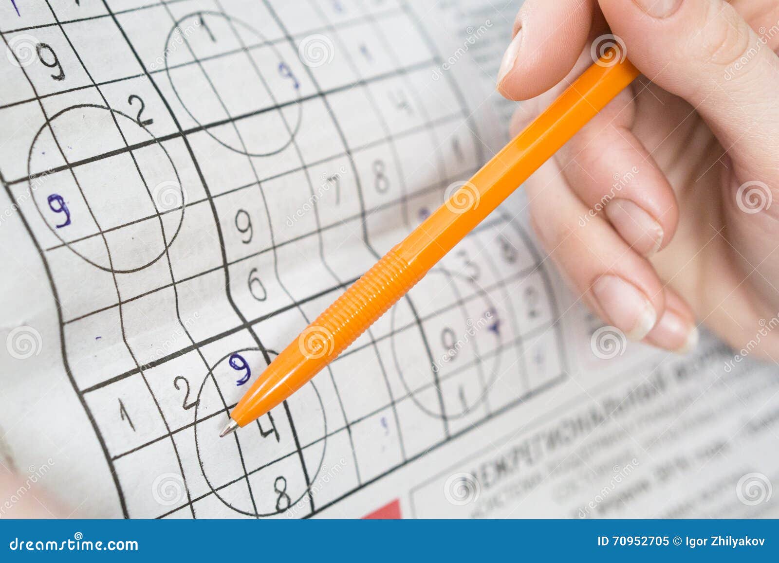 Man solves crossword stock image. Image of numbers, writing 70952705