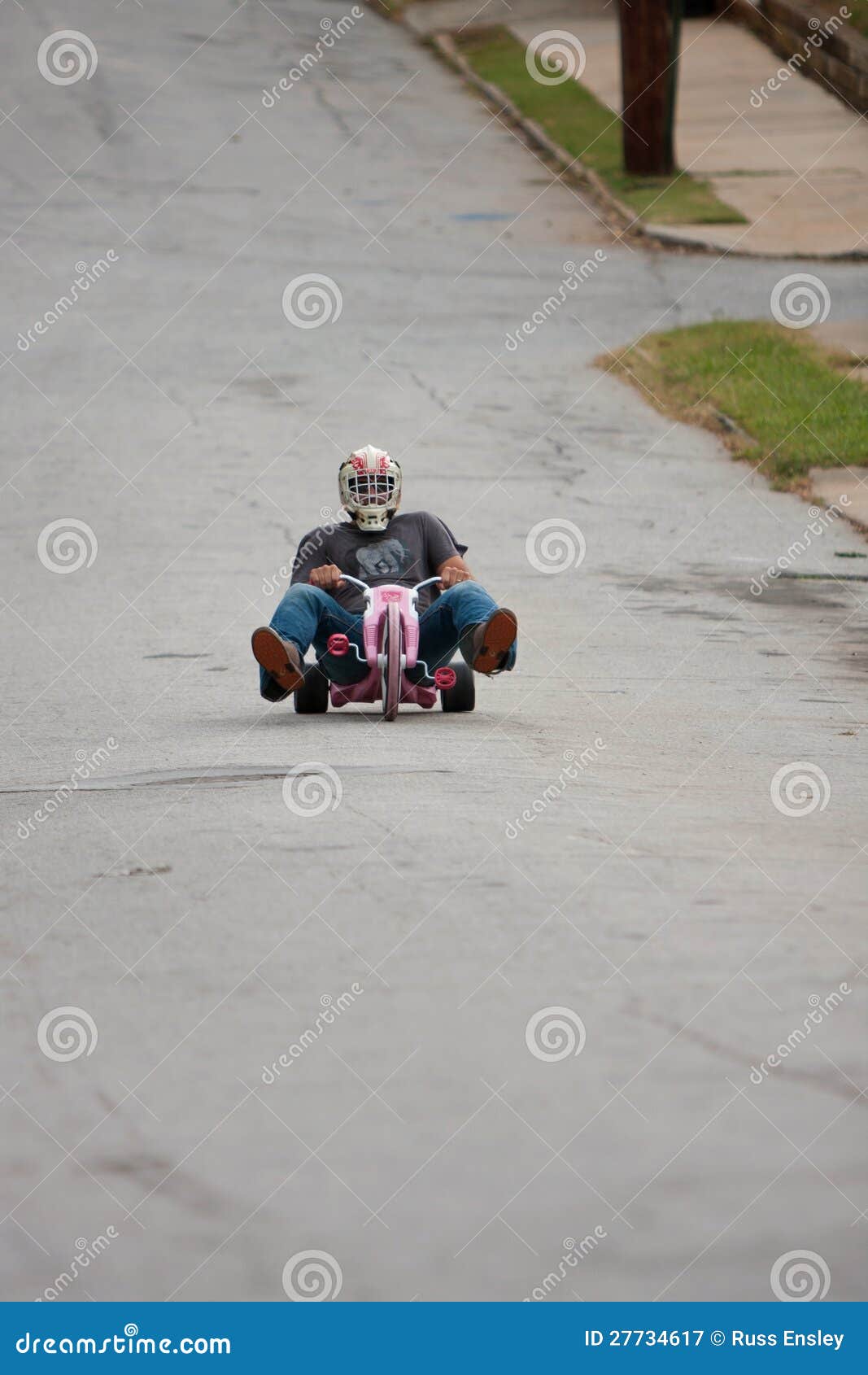 Man Speeds Down Hill on Big Wheel Editorial Photography Image of
