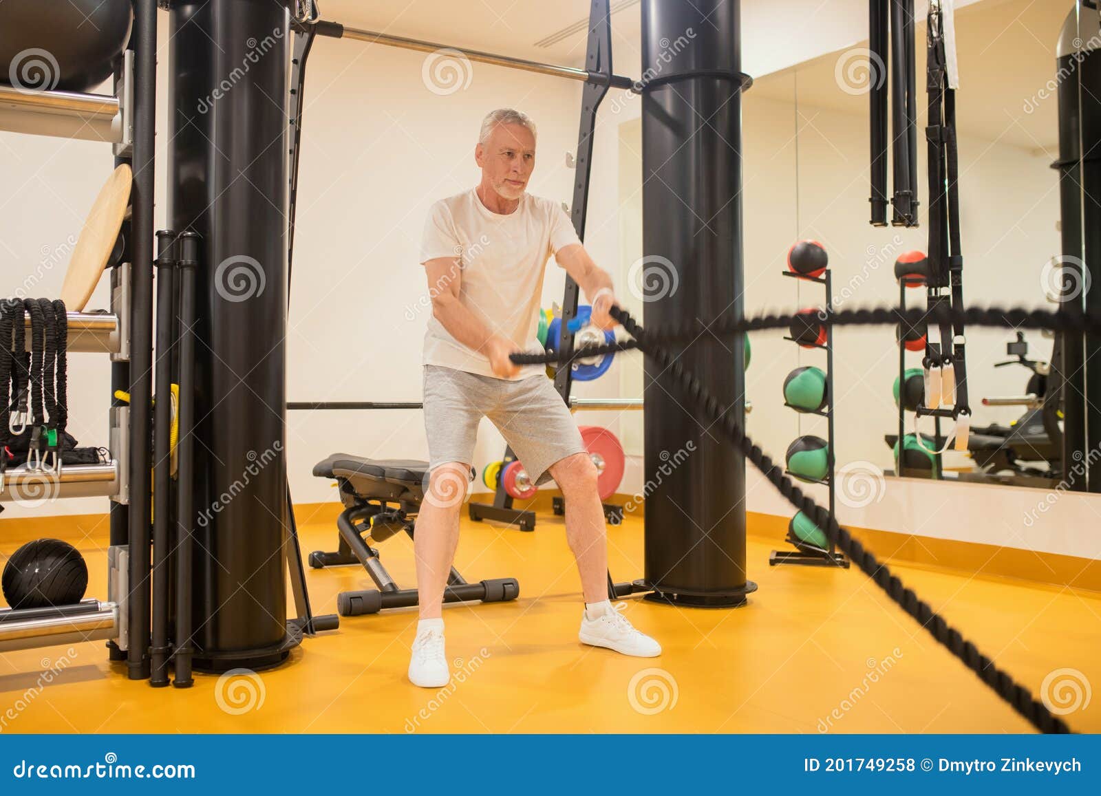 A Man in Sportswear Pulling the Ropes in Gym Stock Photo Image of