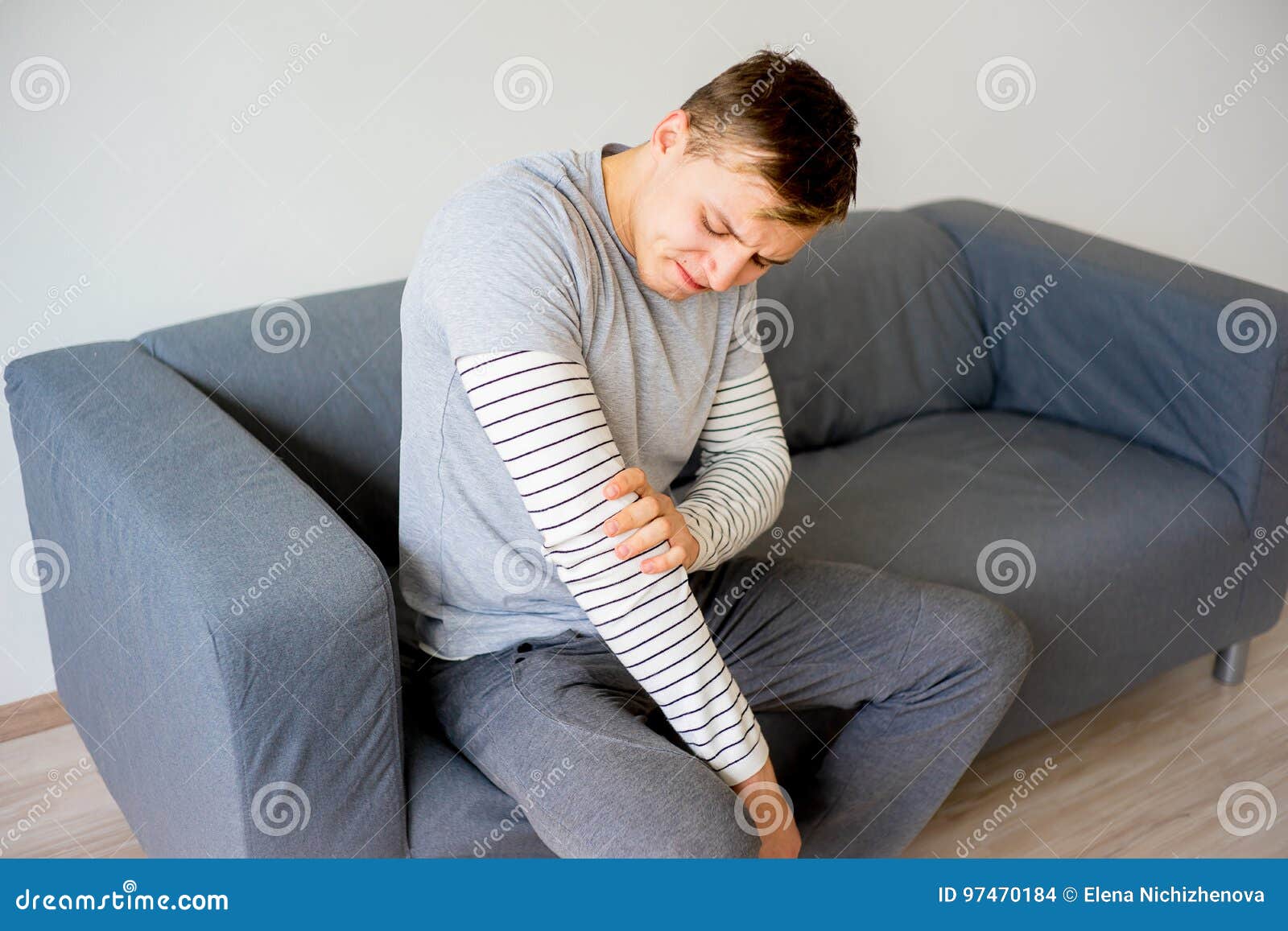 Man sprained his arm stock photo. Image of pain, ache 97470184