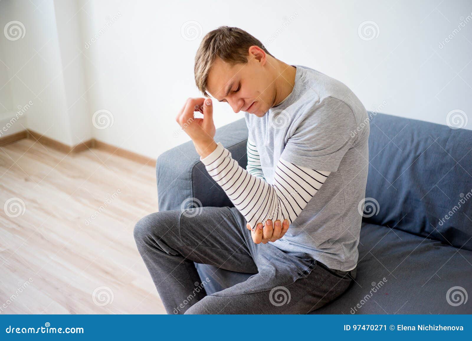 Man sprained his arm stock image. Image of male, pain 97470271