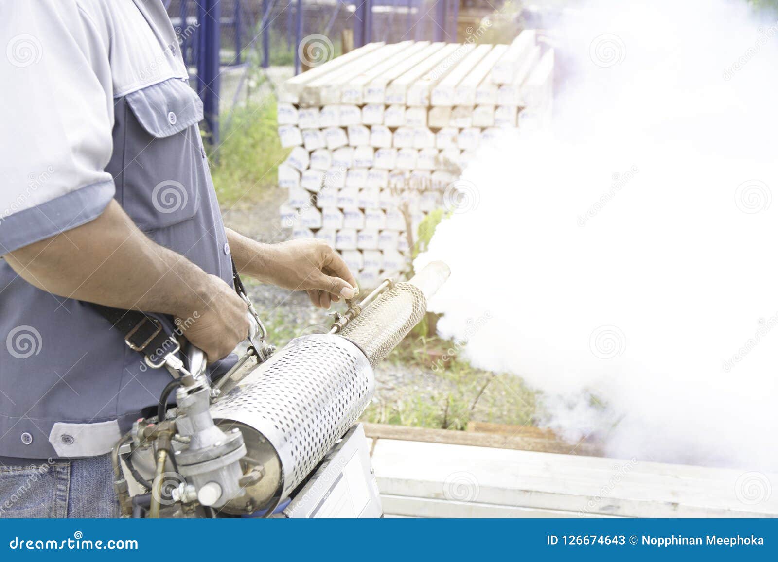man are spraying mosquitoes to get rid of mosquitoes causing dengue fever