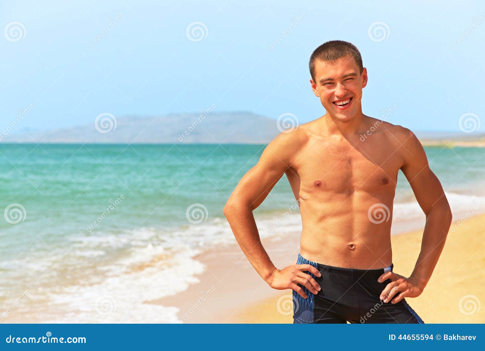 Man standing on the beach stock photo. Image of happy - 44655594