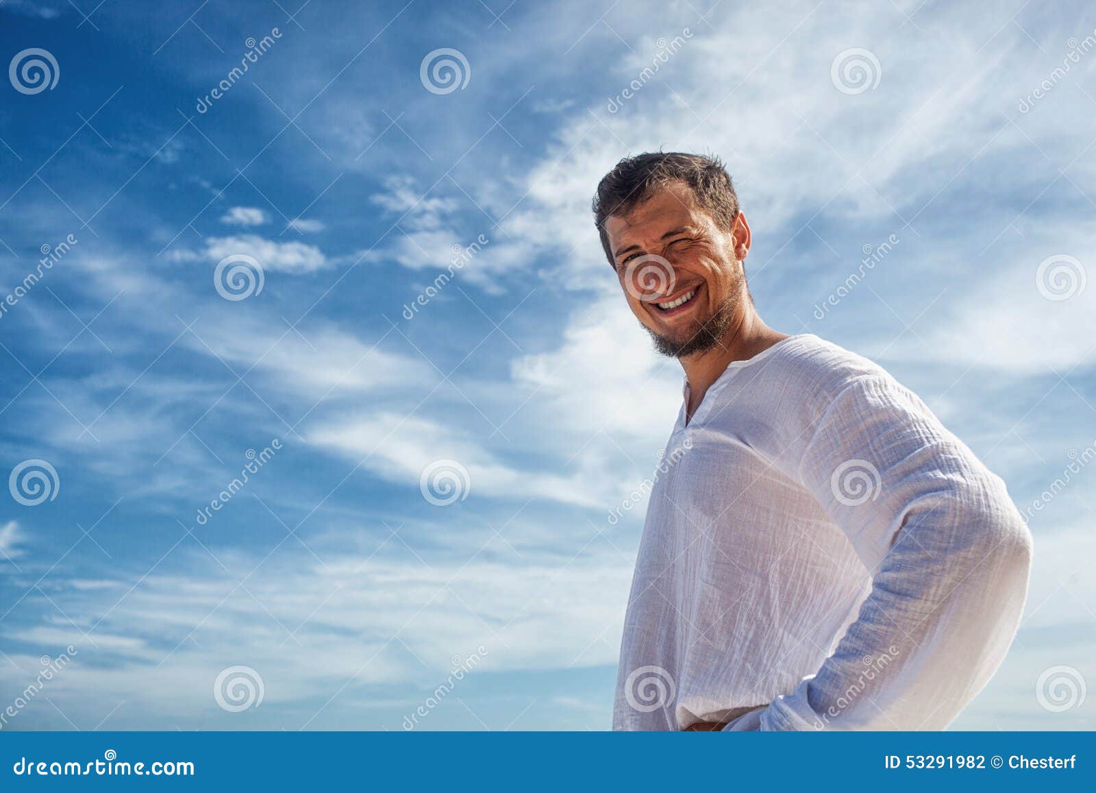Man Standing before Blue Skies with Clouds Stock Photo - Image of warm ...