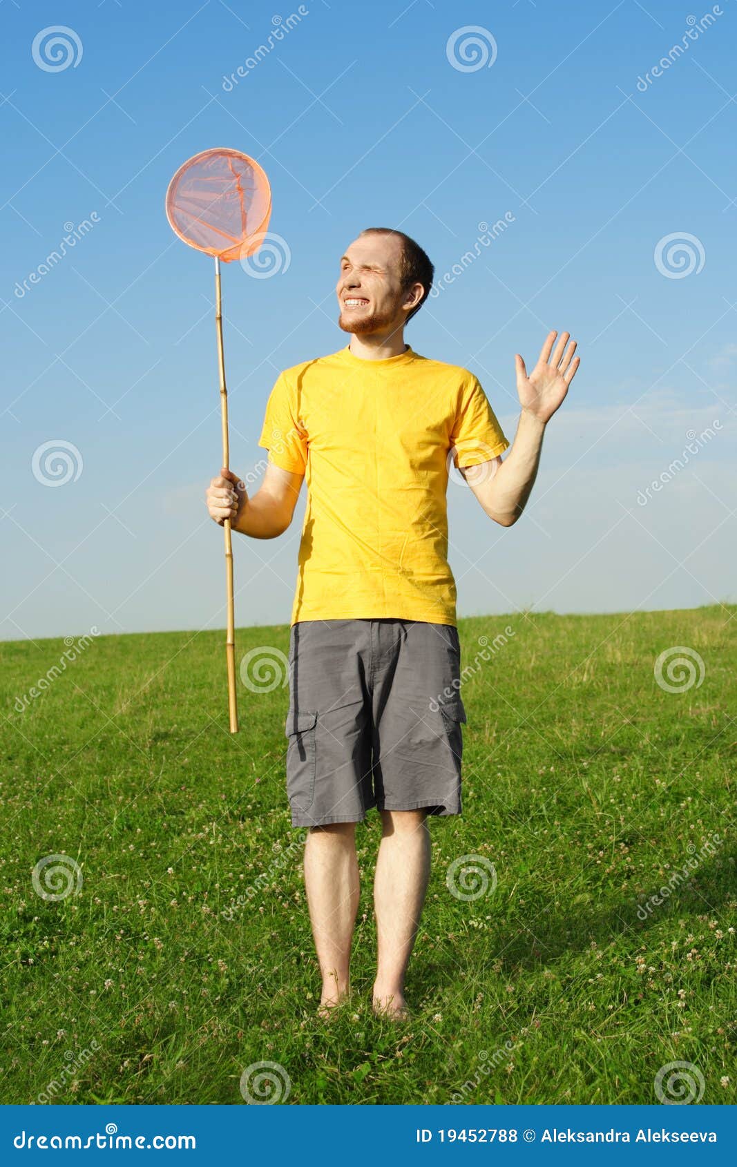 Man Standing on Meadow and Holding Butterfly Net Stock Photo - Image of  field, ground: 19452788