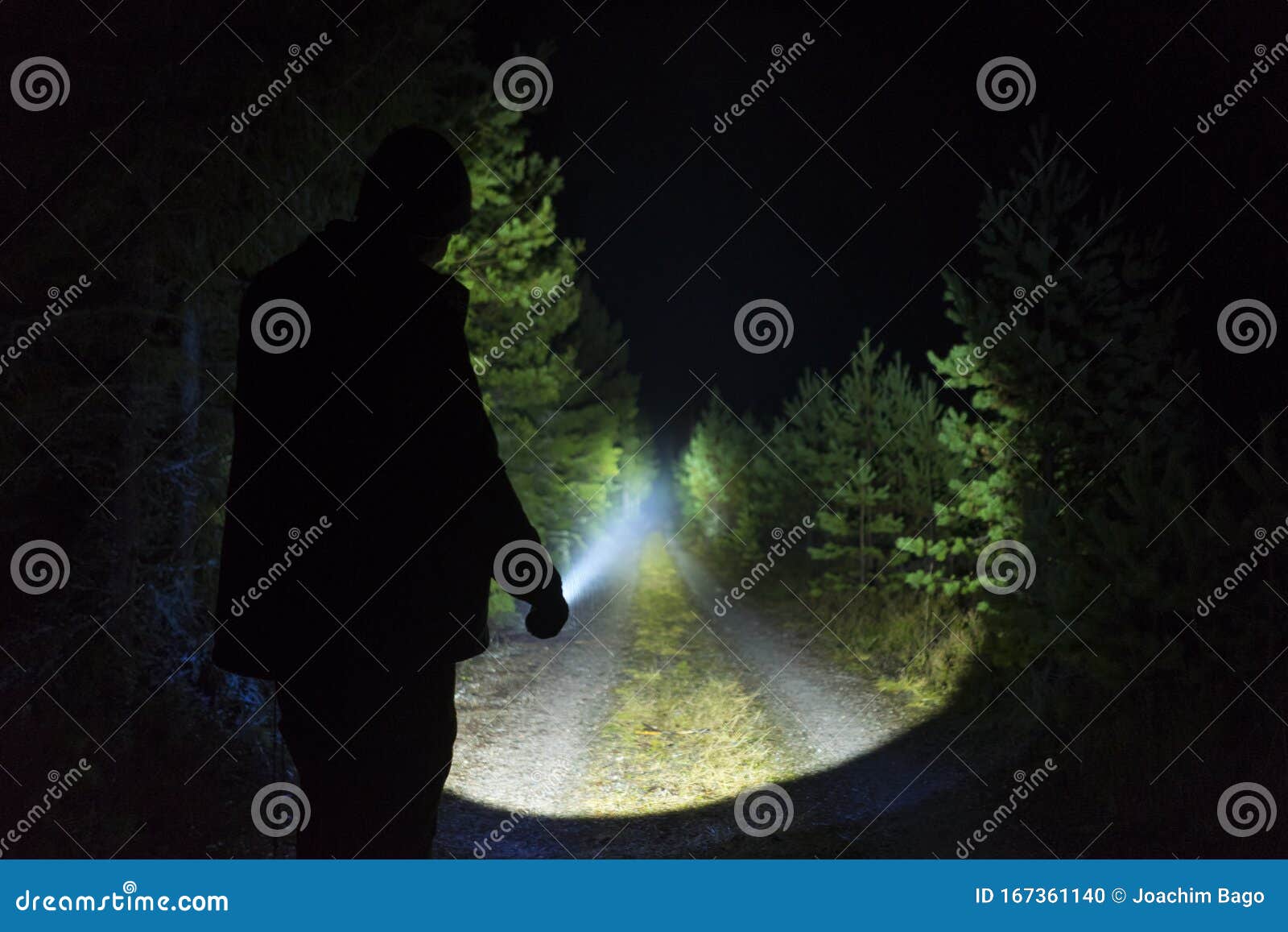 Man Standing Outdoor at Dark Night Shining with Flashlight Stock ...