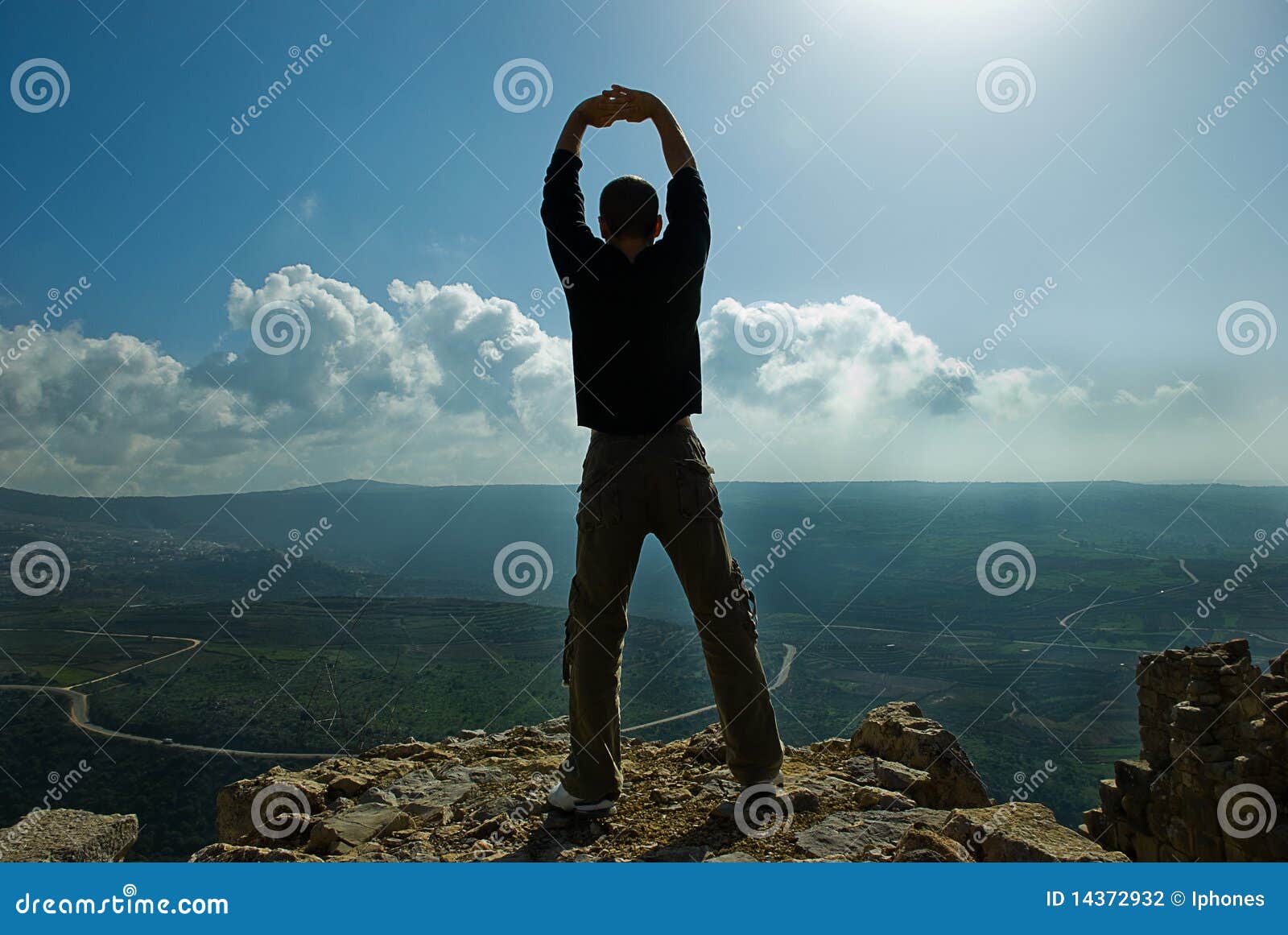 man standing at the precipice