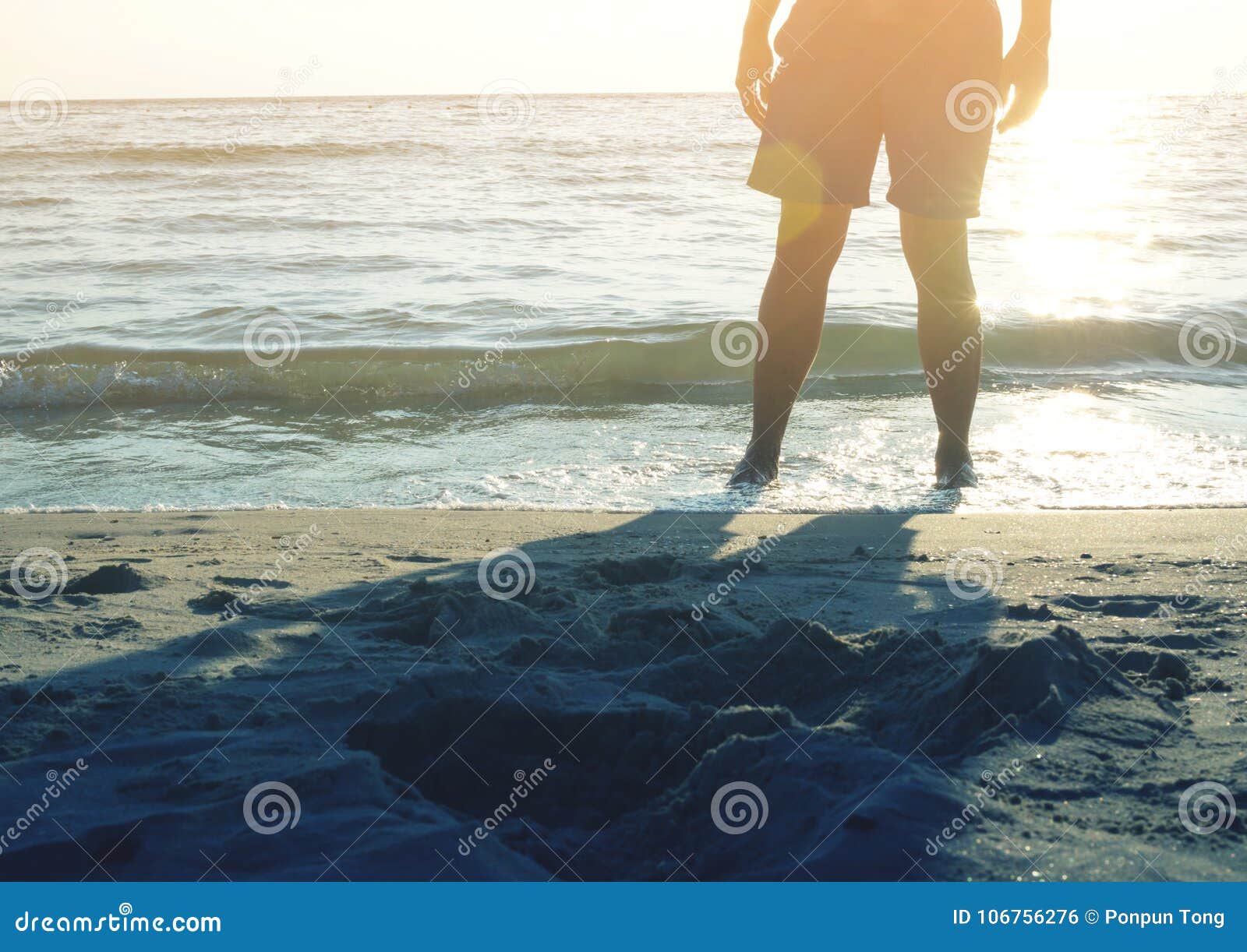 Man Standing At Sunset Beach Stock Photo Image Of Body Beach 106756276