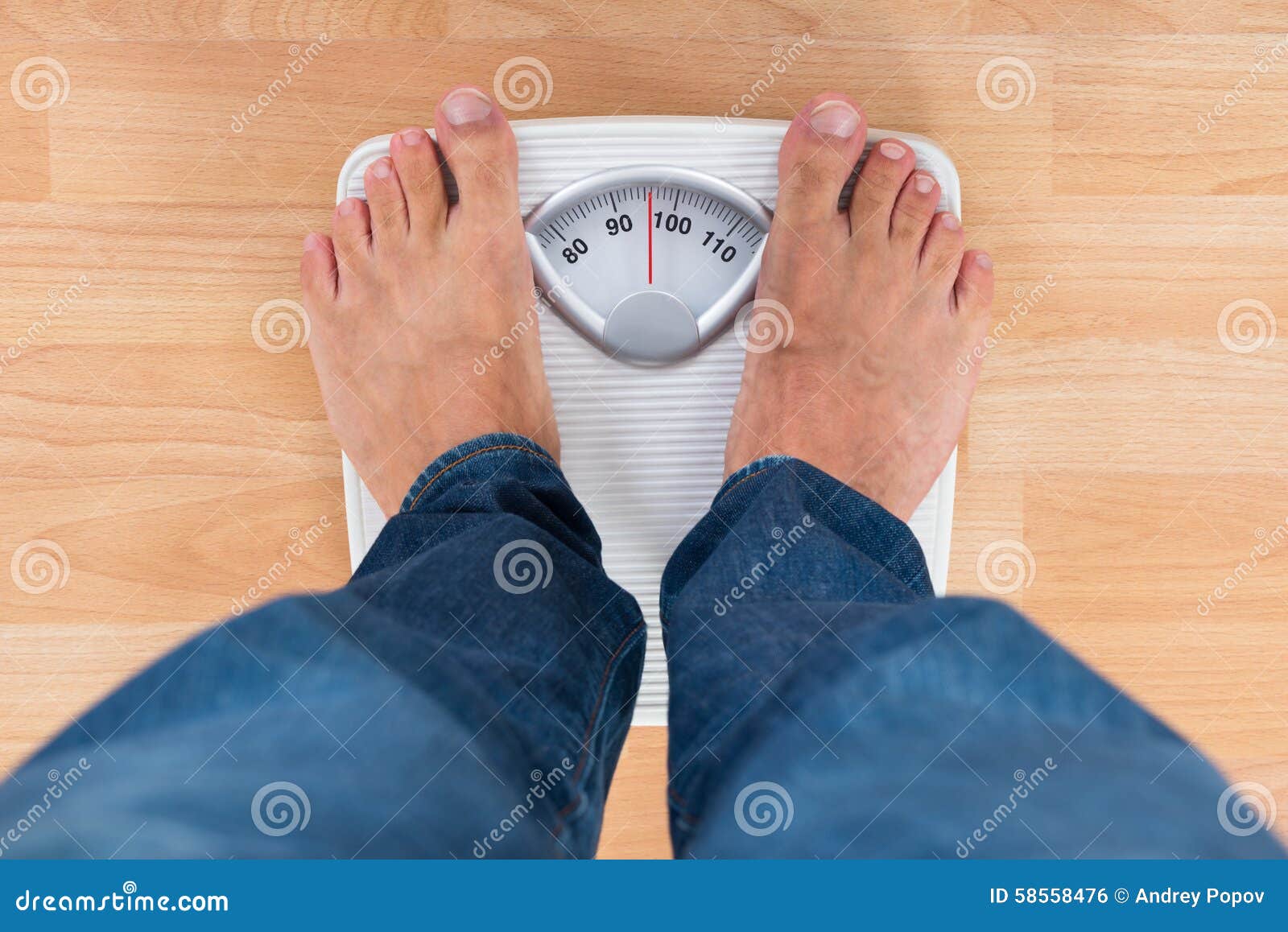 Bare feet standing on a scales. Lose weight concept with person on a scale  measuring kilograms. Weight Scale, Underweight man on Scale Stock Photo -  Alamy