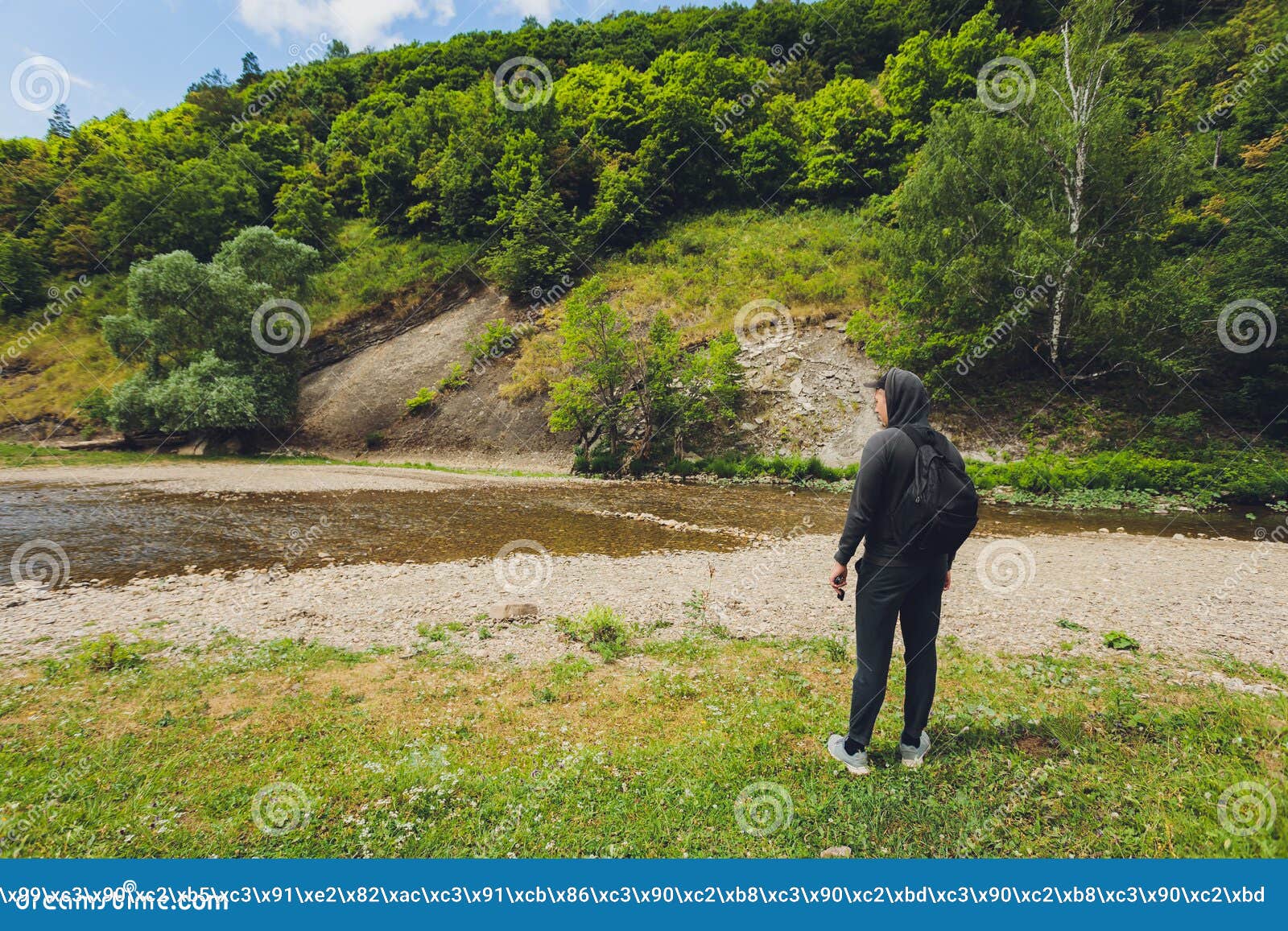 A Man Stands on the Shore of a Mountain River. Stock Image Image of