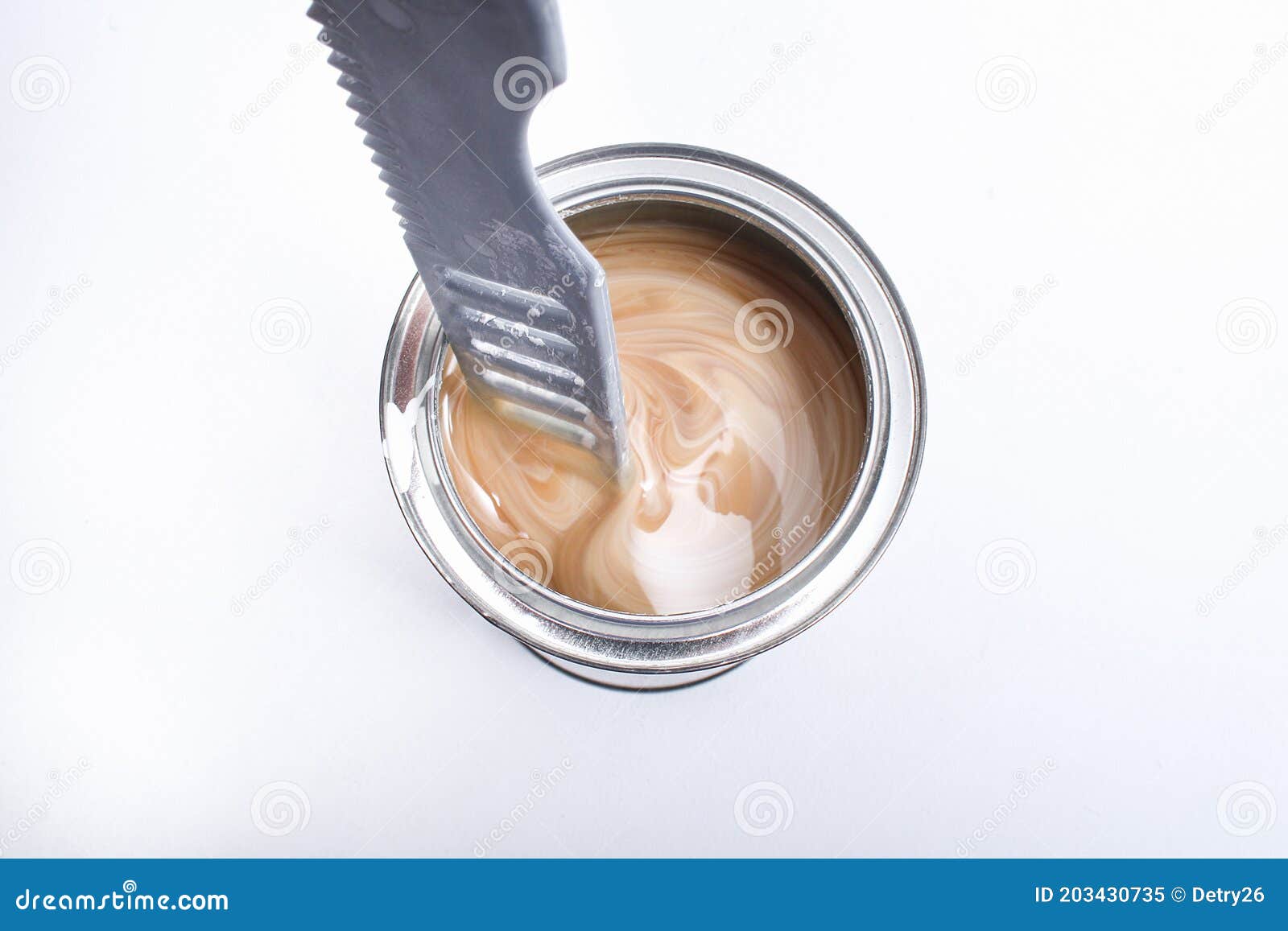 A Man Stirring White Paint in Can on White Background. Renovation