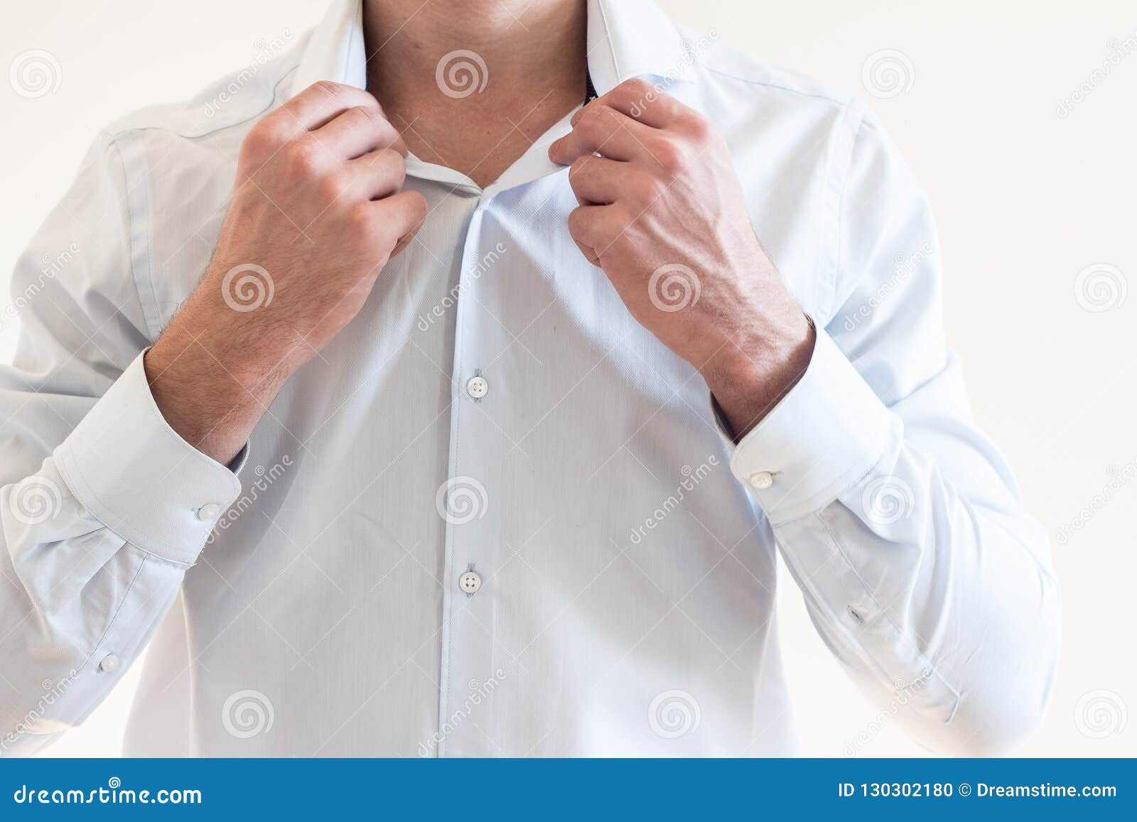 Man Straightens the Collar of His Shirt Stock Photo - Image of body ...