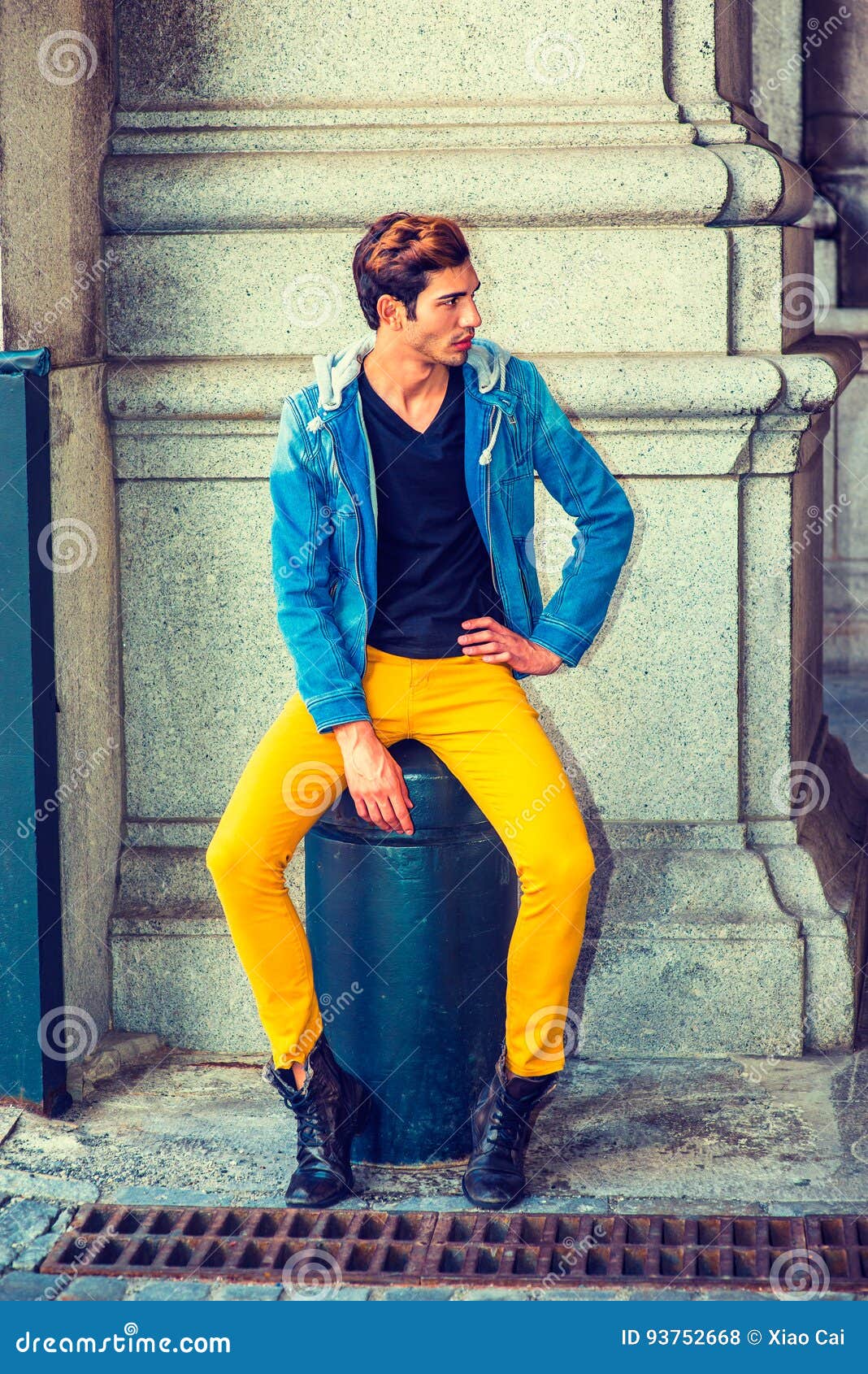 a woman wearing a yellow shirt and black pants Stock Photo by Icons8