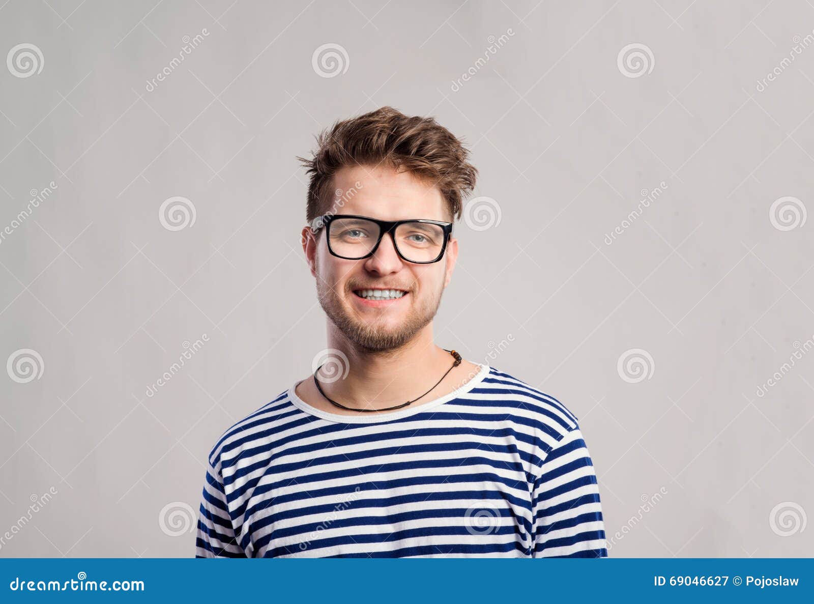 Man In Striped T-shirt And Eyeglasses Against Gray Background. Stock ...