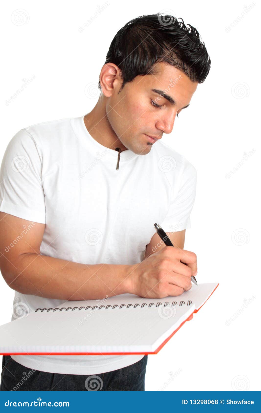 man or student writes in a notebook