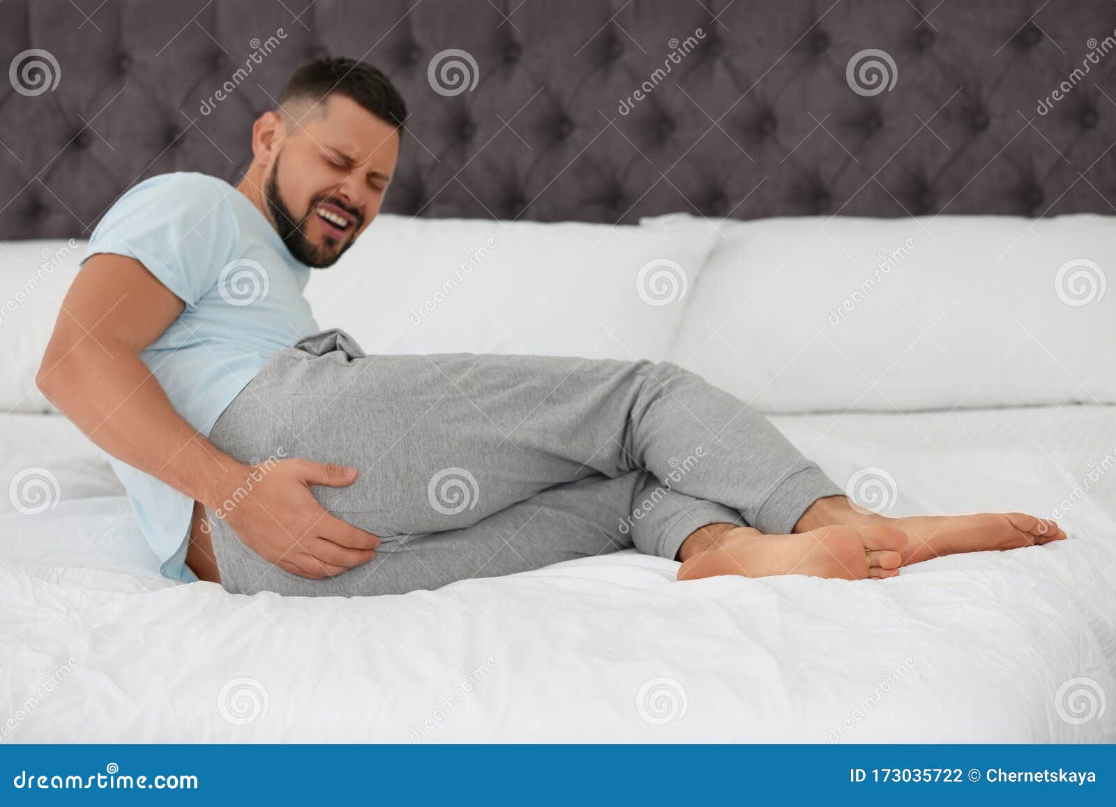Man Suffering from Hemorrhoid on Bed Stock Photo Image of disease
