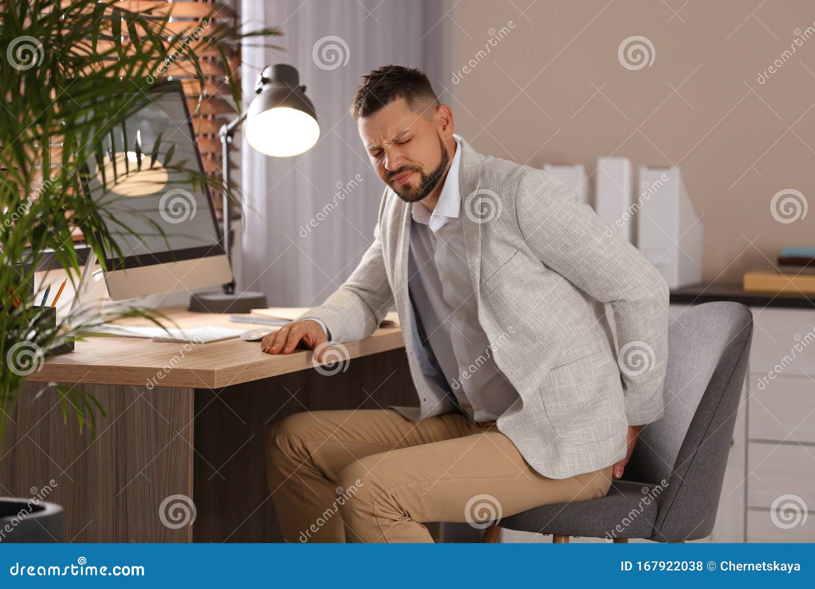 Man Suffering from Hemorrhoid at Workplace Stock Photo Image of desk