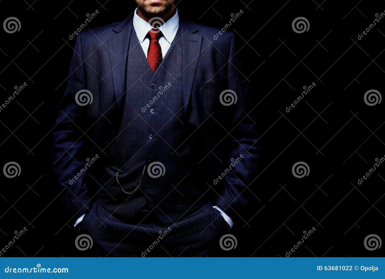 man in suit on black background