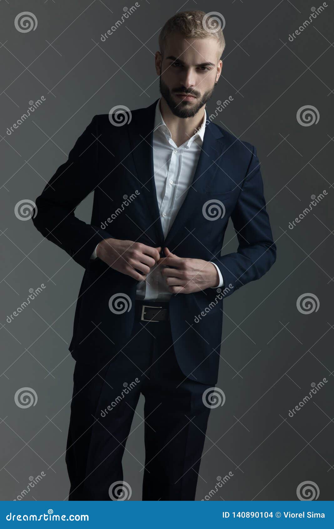 Man in Suit Buttoning His Lounge Jacket Stock Photo - Image of ...