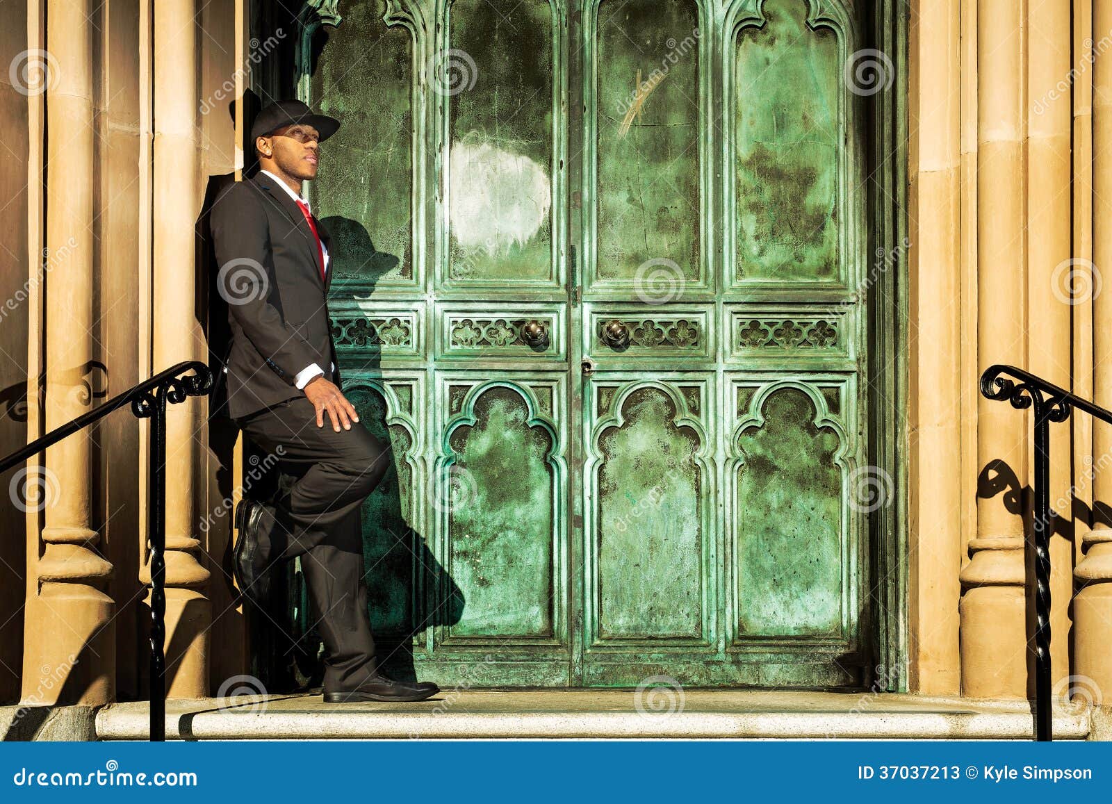 Man in Suit Standing in Front of Old Doors Stock Image Image of