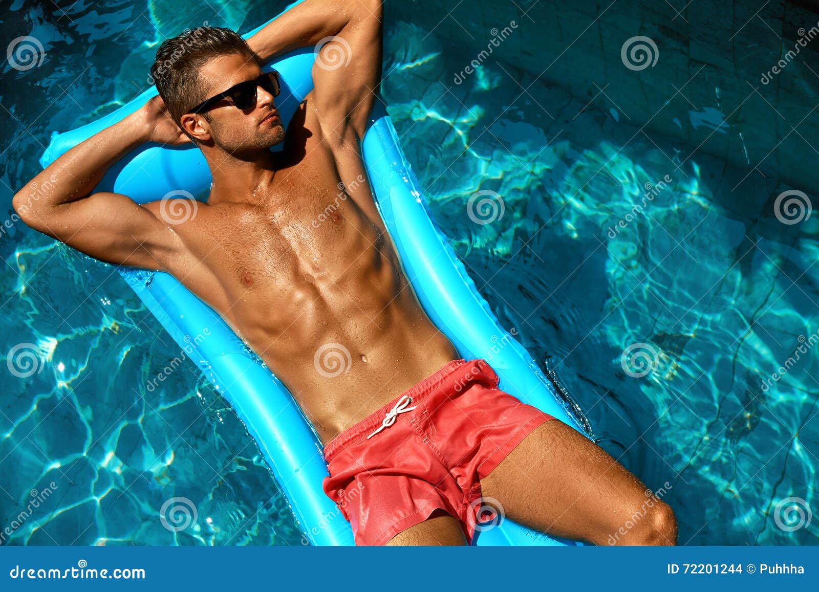 man summer fashion. male model tanning by pool. skin tan