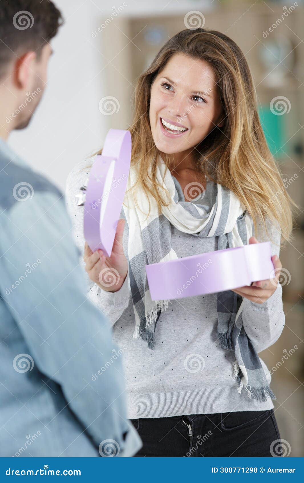 Man Surprising Girlfriend with Gift Stock Photo Image of house