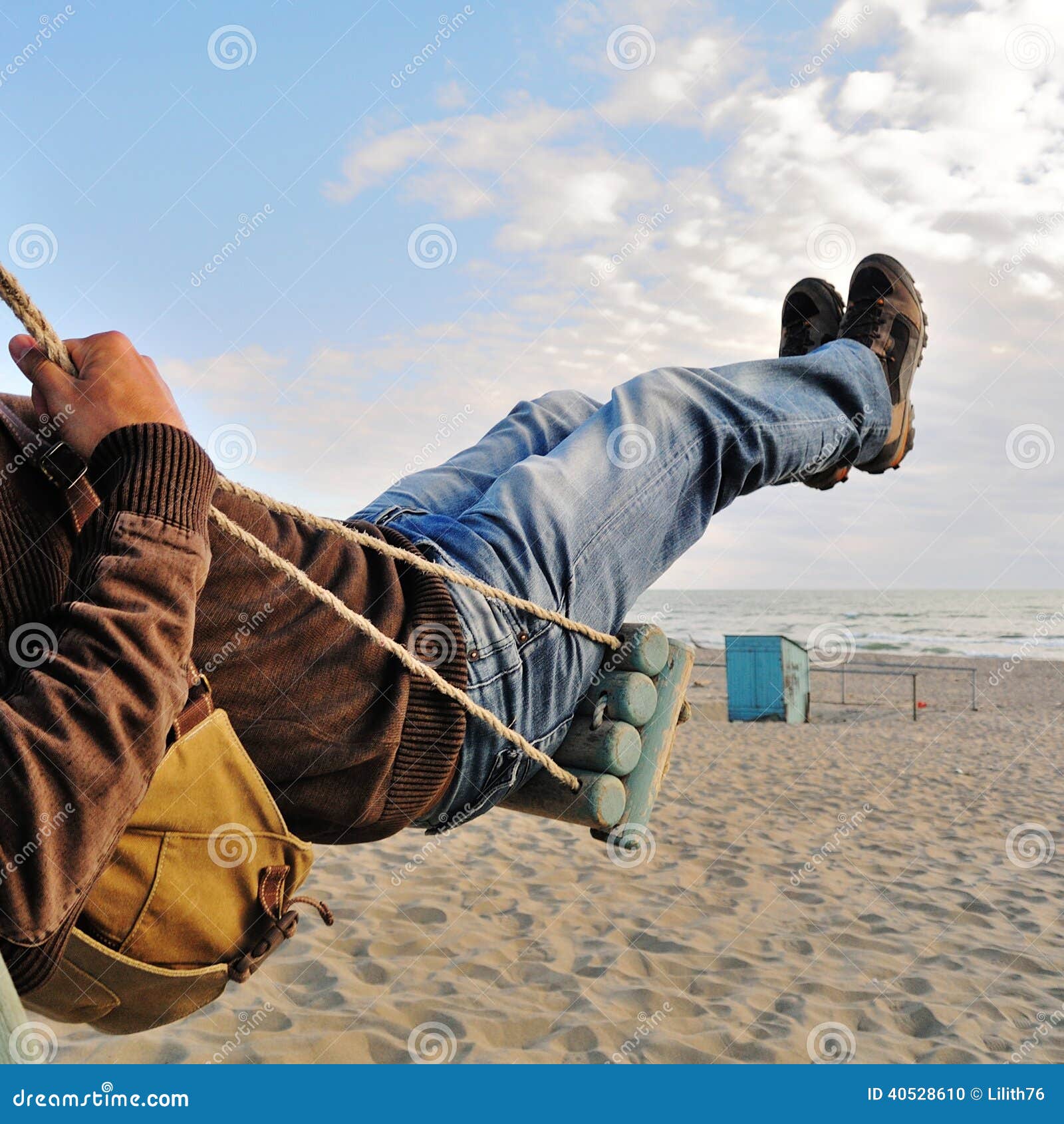 Man on a swing stock photo. Image of shoes, sand, jeans 40528610