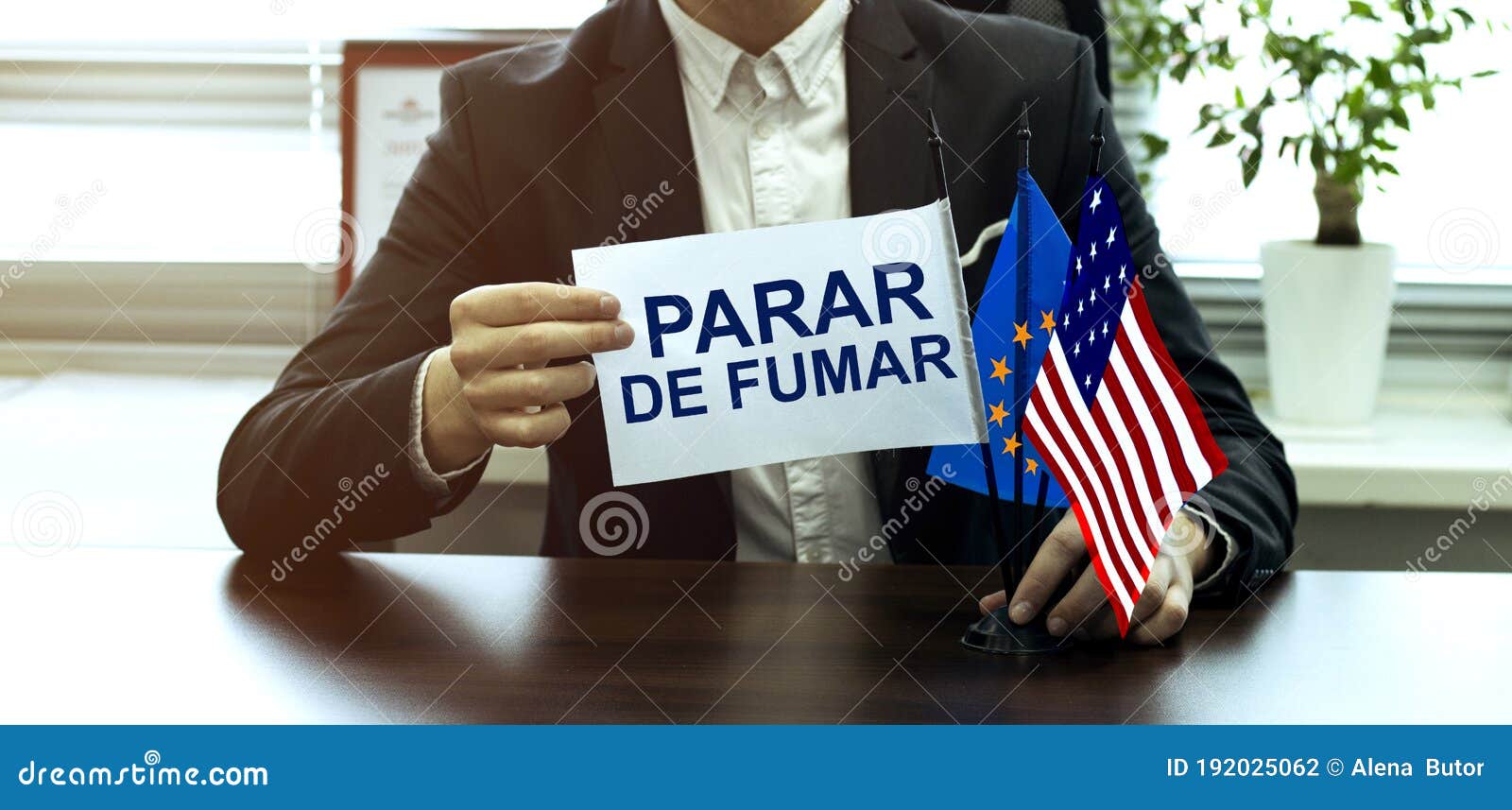 man take a flag with text parar de fumar with flags on the office background
