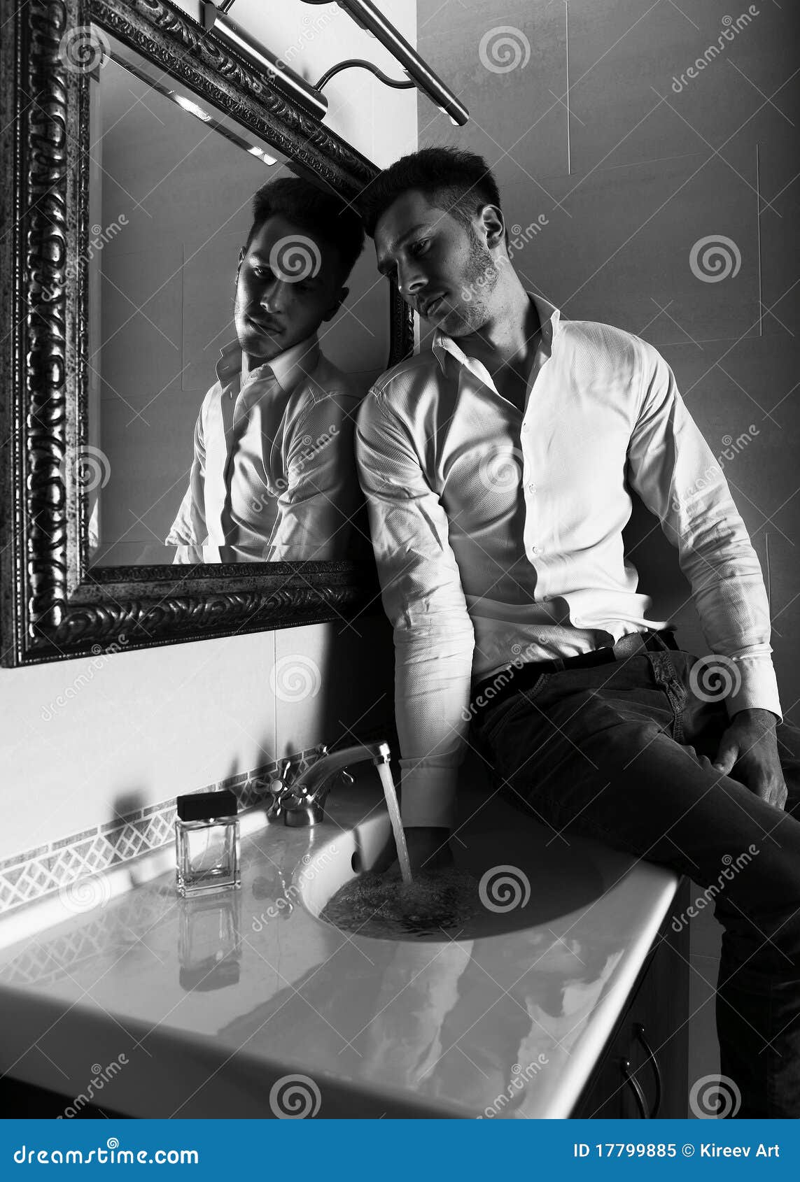 Man Takes a Look at Himself in the Mirror. Stock Image - Image of ...