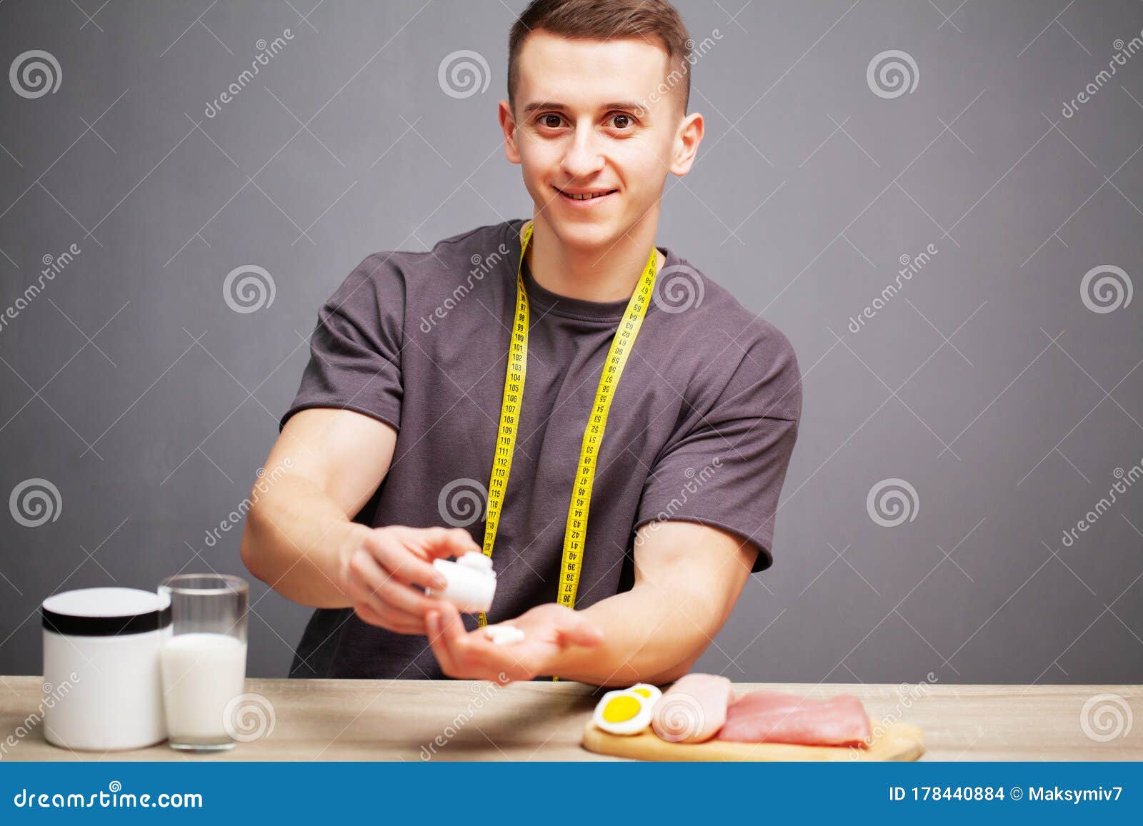 Man Takes a Pill of Amino Acids after Training. Stock Photo Image of