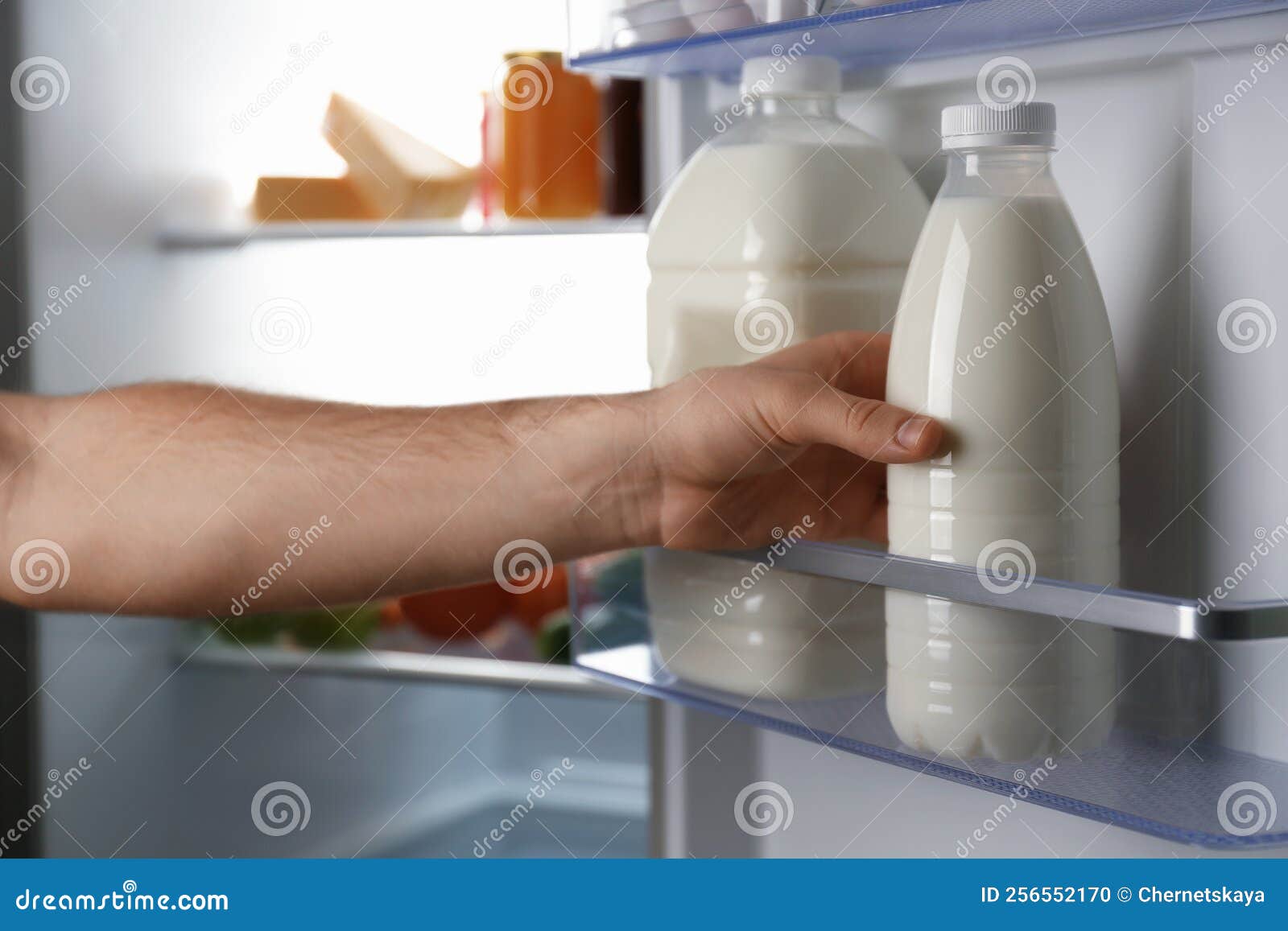 Man Taking Gallon of Milk from Refrigerator, Closeup Stock Photo Image of delicious, hand